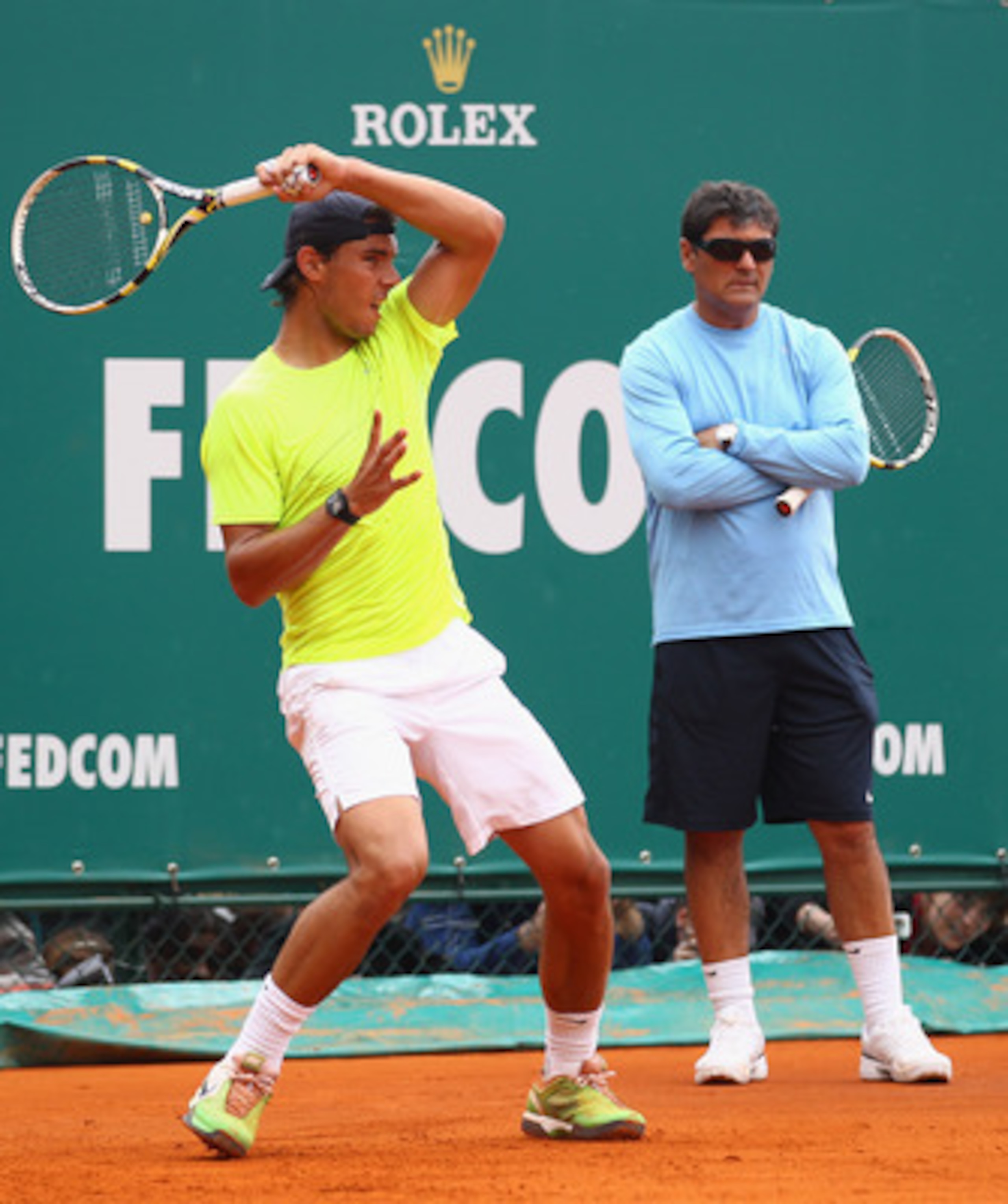 MONACO - APRIL 10: Rafael Nadal of Spain plays a forehand as Toni Nadal, uncle & coach, watches on during Day One of the ATP Masters Series Tennis at the Monte Carlo Country Club on April 10, 2011 in Monte Carlo, Monaco. (Photo by Julian Finney/Getty Im MONACO - APRIL 10: Rafael Nadal of Spain plays a forehand as Toni Nadal, uncle & coach, watches on during Day One of the ATP Masters Series Tennis at the Monte Carlo Country Club on April 10, 2011 in Monte Carlo, Monaco. (Photo by Julian Finney/Getty Im