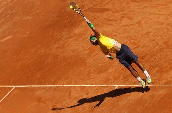 ROME, ITALY - MAY 13:  Rafael Nadal of Spain serves during his quarter final match against Marin Cilic of Croatia during day six of the Internazoinali BNL D'Italia at the Foro Italico Tennis Centre  on May 13, 2011 in Rome, Italy.  (Photo by Clive Brunski
