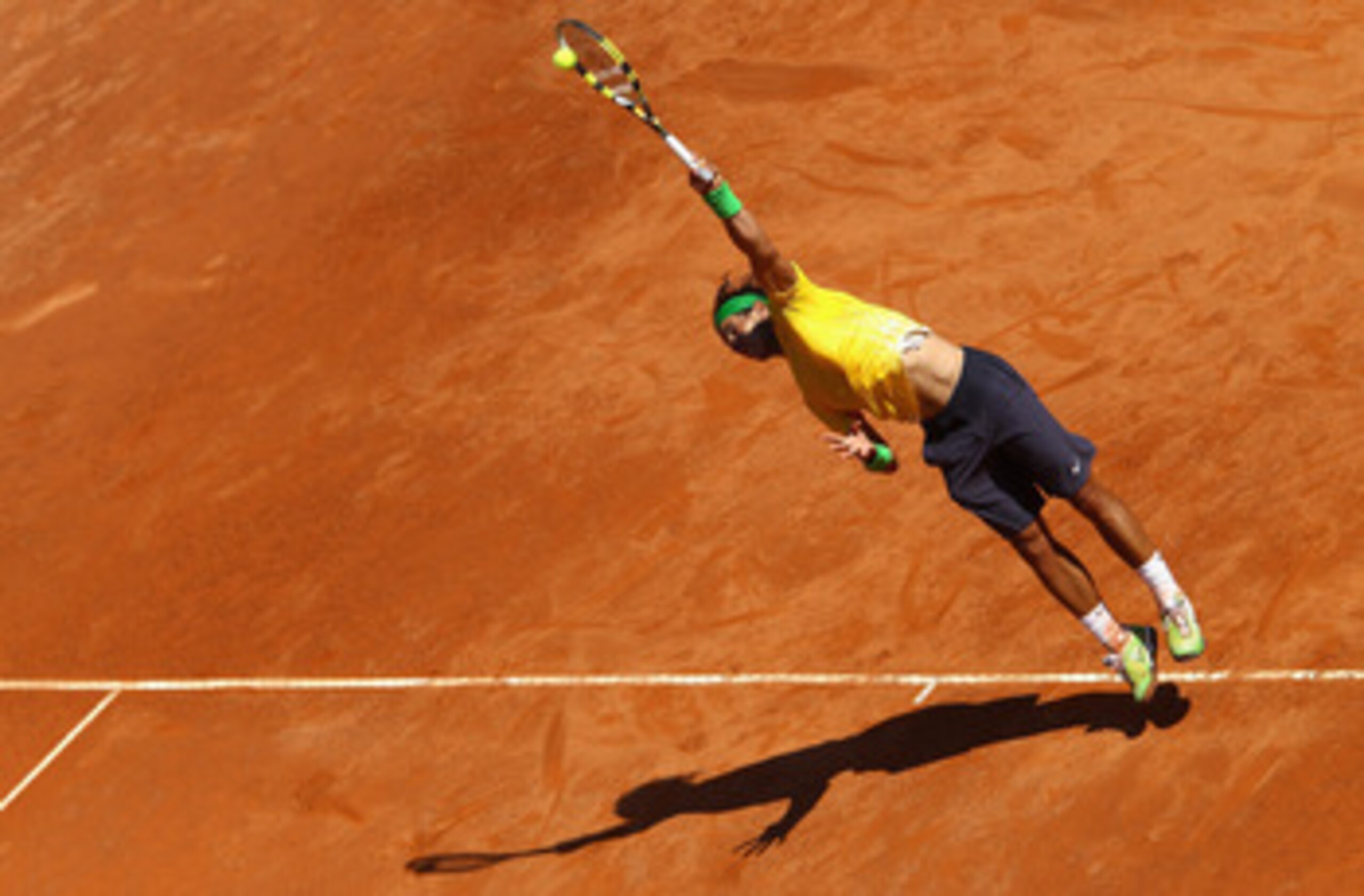ROME, ITALY - MAY 13: Rafael Nadal of Spain serves during his quarter final match against Marin Cilic of Croatia during day six of the Internazoinali BNL D'Italia at the Foro Italico Tennis Centre on May 13, 2011 in Rome, Italy. (Photo by Clive Brunski ROME, ITALY - MAY 13: Rafael Nadal of Spain serves during his quarter final match against Marin Cilic of Croatia during day six of the Internazoinali BNL D'Italia at the Foro Italico Tennis Centre on May 13, 2011 in Rome, Italy. (Photo by Clive Brunski