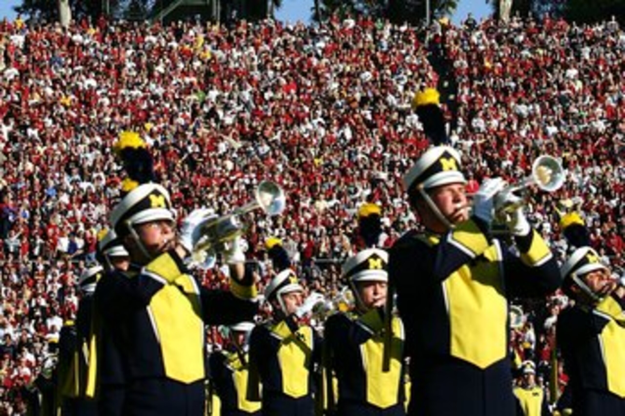 PASADENA, CA - JANUARY 01:  The United States Flag is seen at half mast in honor of President Gerald Ford, a former Michigan Wolverine, as the Michigan marching band plays the National Anthem prior to the game against the USC Trojans on January 1, 2007 at