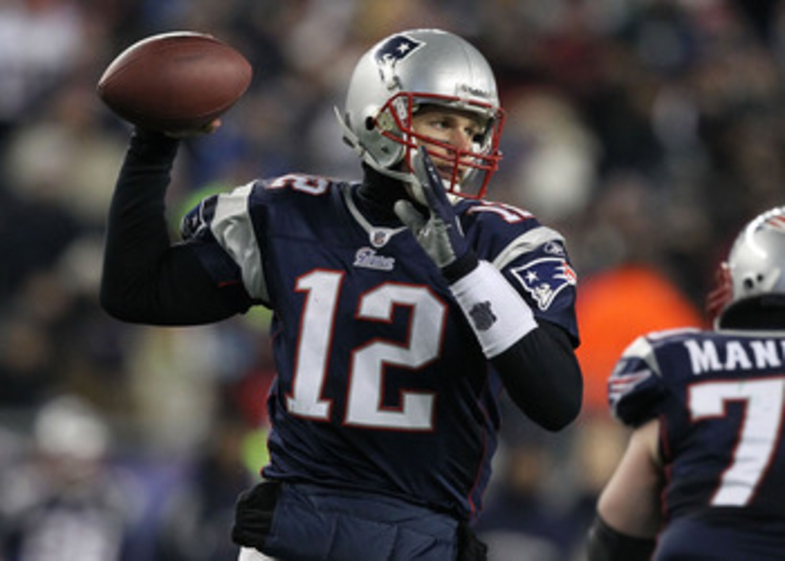 FOXBORO, MA - JANUARY 16:  Quarterback Tom Brady #12 of the New England Patriots throws a pass during their 2011 AFC divisional playoff game against the New York Jets at Gillette Stadium on January 16, 2011 in Foxboro, Massachusetts.  (Photo by Al Bello/G