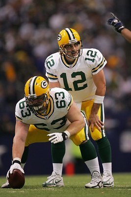 IRVING - NOVEMBER 29:  Aaron Rodgers #12 and Scott Wells #63 of the Green Bay Packers prepare to snap the ball during the NFL game against the Dallas Cowboys at the Texas Stadium on November 29, 2007 in Irving, Texas. (Photo by Ronald Martinez/Getty Image
