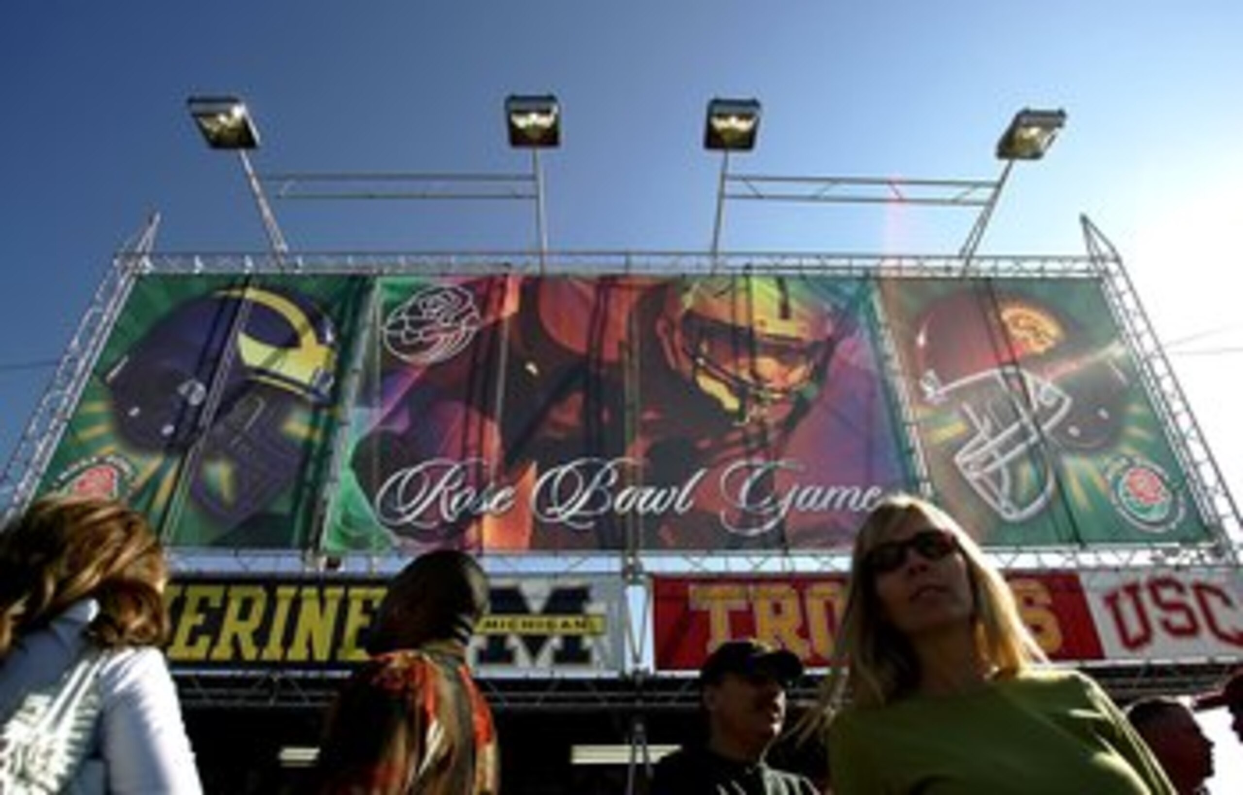 PASADENA, CA - JANUARY 01:  Fans gather in front of the entrance to the Rose Bowl prior to the game against the Michigan Wolverines and the USC Trojans on January 1, 2007 at the Rose Bowl in Pasadena, California.  (Photo by Harry How/Getty Images)