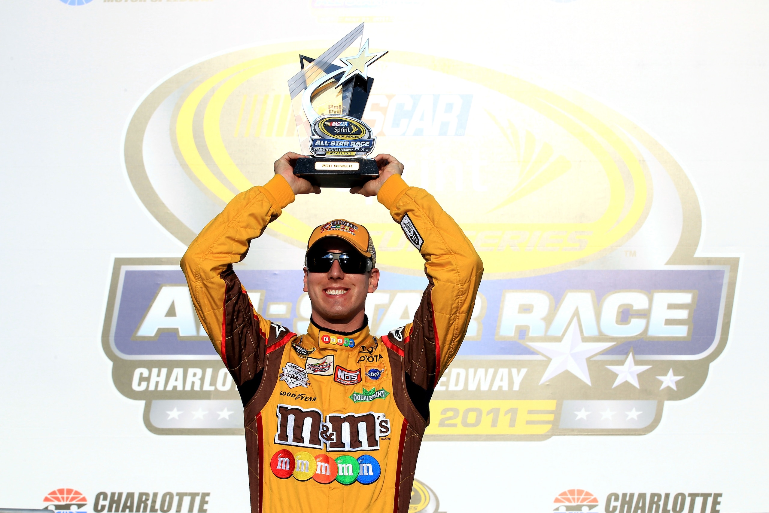 CHARLOTTE, NC - MAY 20:  Kyle Busch, driver of the #18 M&M's Toyota, celebrates setting the pole position during qualifying for the NASCAR Sprint All-Star Race at Charlotte Motor Speedway on May 20, 2011 in Charlotte, North Carolina.  (Photo by Streeter L
