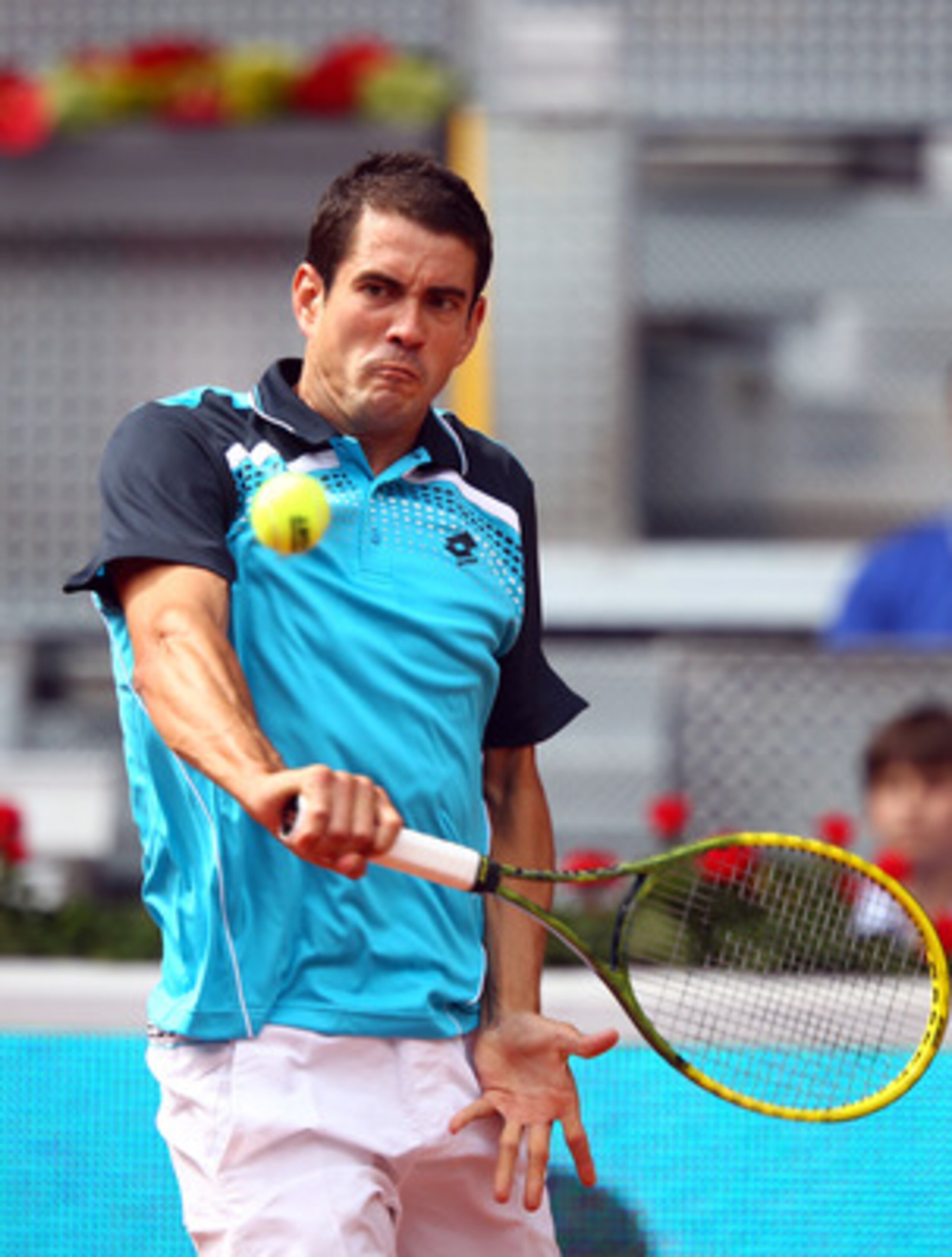 MADRID, SPAIN - MAY 01:  Guillermo Garcia-Lopez of Spain plays a backhand in his match against Stanislas Wawrinka of Switzerland during day two of the Mutua Madrilena Madrid Open Tennis on May 1, 2011 in Madrid, Spain.  (Photo by Julian Finney/Getty Image