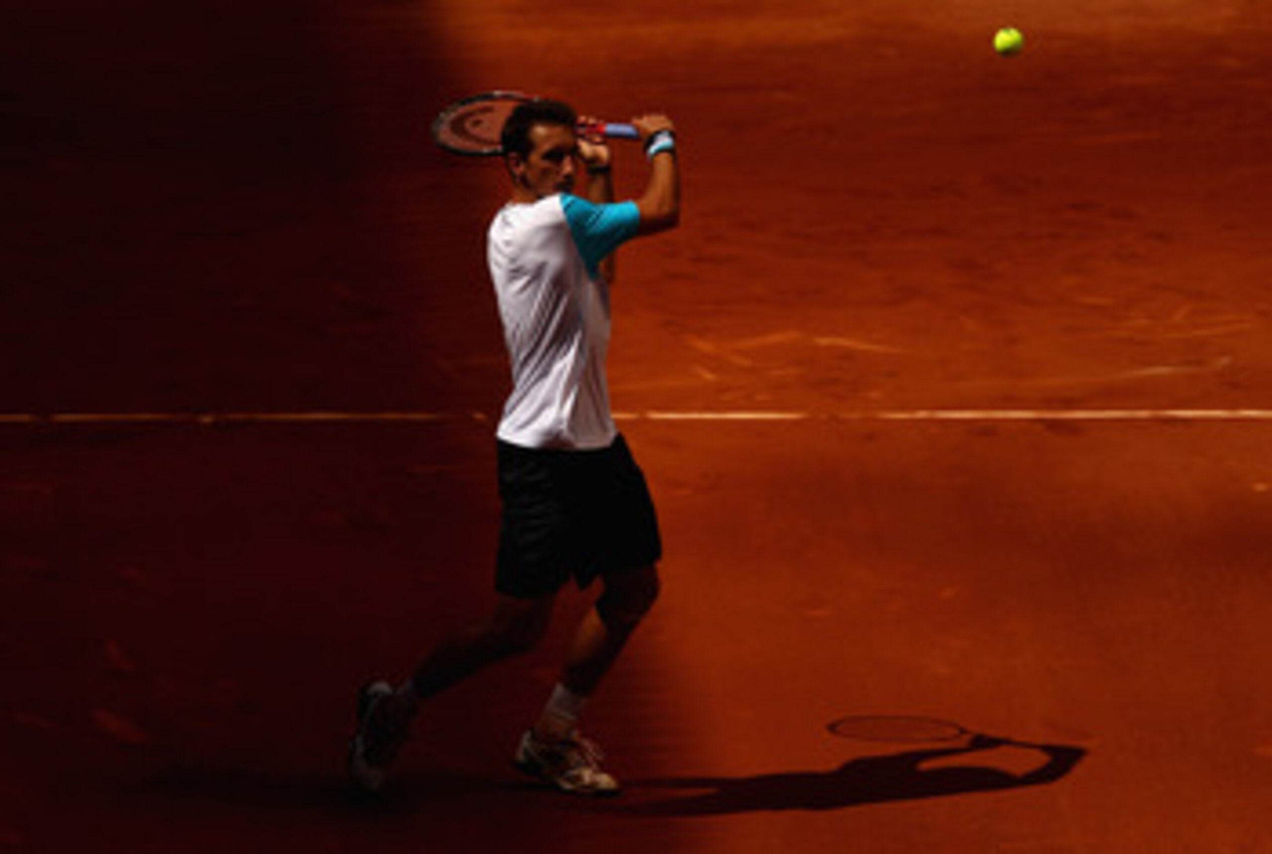 MADRID, SPAIN - MAY 02:  Sergiy Stakhovsky of Ukraine plays a backhand to Albert Montanes of Spain during day three of the Mutua Madrilena Madrid Open Tennis on May 2, 2011 in Madrid, Spain.  (Photo by Julian Finney/Getty Images)