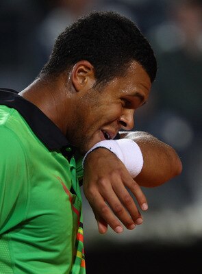 ROME, ITALY - MAY 11:  Jo-Wilfried Tsonga of France shows his dejection during his second round match against Roger Federer of Switzerland during day four of the Internazoinali BNL D'Italia at the Foro Italico Tennis Centre on May 11, 2011 in Rome, Italy.