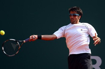 MONACO - APRIL 12:  Janko Tipsarevic of Serbia plays a forehand in his match against Feliciano Lopez of Spain during Day Three of the ATP Masters Series Tennis at the Monte Carlo Country Club on April 12, 2011 in Monte Carlo, Monaco.  (Photo by Julian Fin