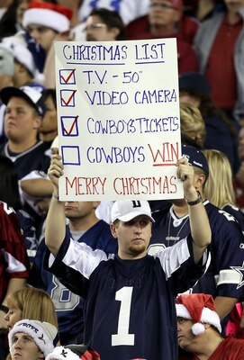 GLENDALE, AZ - DECEMBER 25: A fan of the Dallas Cowboys holds up a sign during the NFL game against the Arizona Cardinals at the University of Phoenix Stadium on December 25, 2010 in Glendale, Arizona. The Cardinals defeated the Cowboys 27-26. (Photo b GLENDALE, AZ - DECEMBER 25: A fan of the Dallas Cowboys holds up a sign during the NFL game against the Arizona Cardinals at the University of Phoenix Stadium on December 25, 2010 in Glendale, Arizona. The Cardinals defeated the Cowboys 27-26. (Photo b