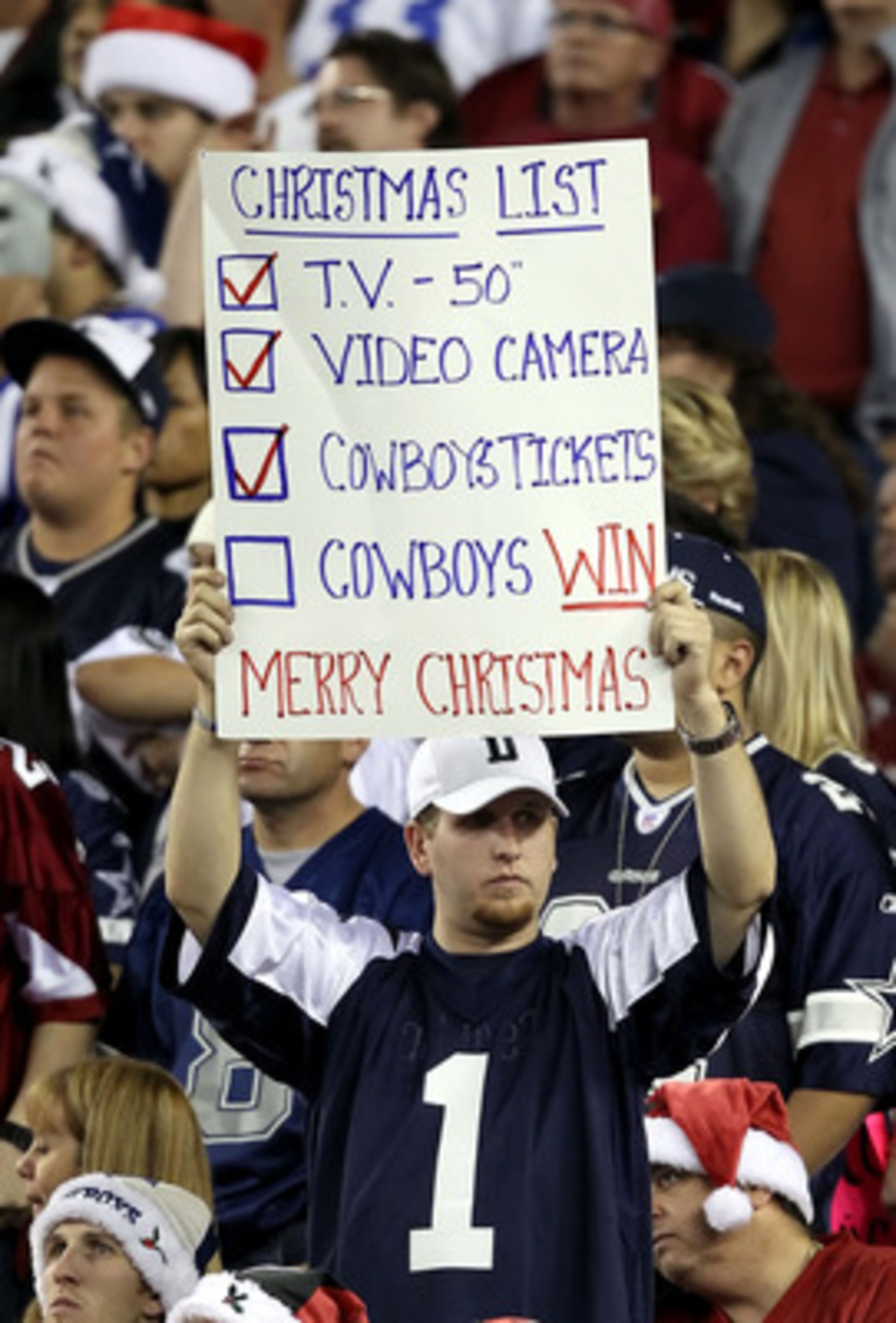 GLENDALE, AZ - DECEMBER 25:  A fan of the Dallas Cowboys holds up a sign during the NFL game against the Arizona Cardinals at the University of Phoenix Stadium on December 25, 2010 in Glendale, Arizona.  The Cardinals defeated the Cowboys 27-26.  (Photo b