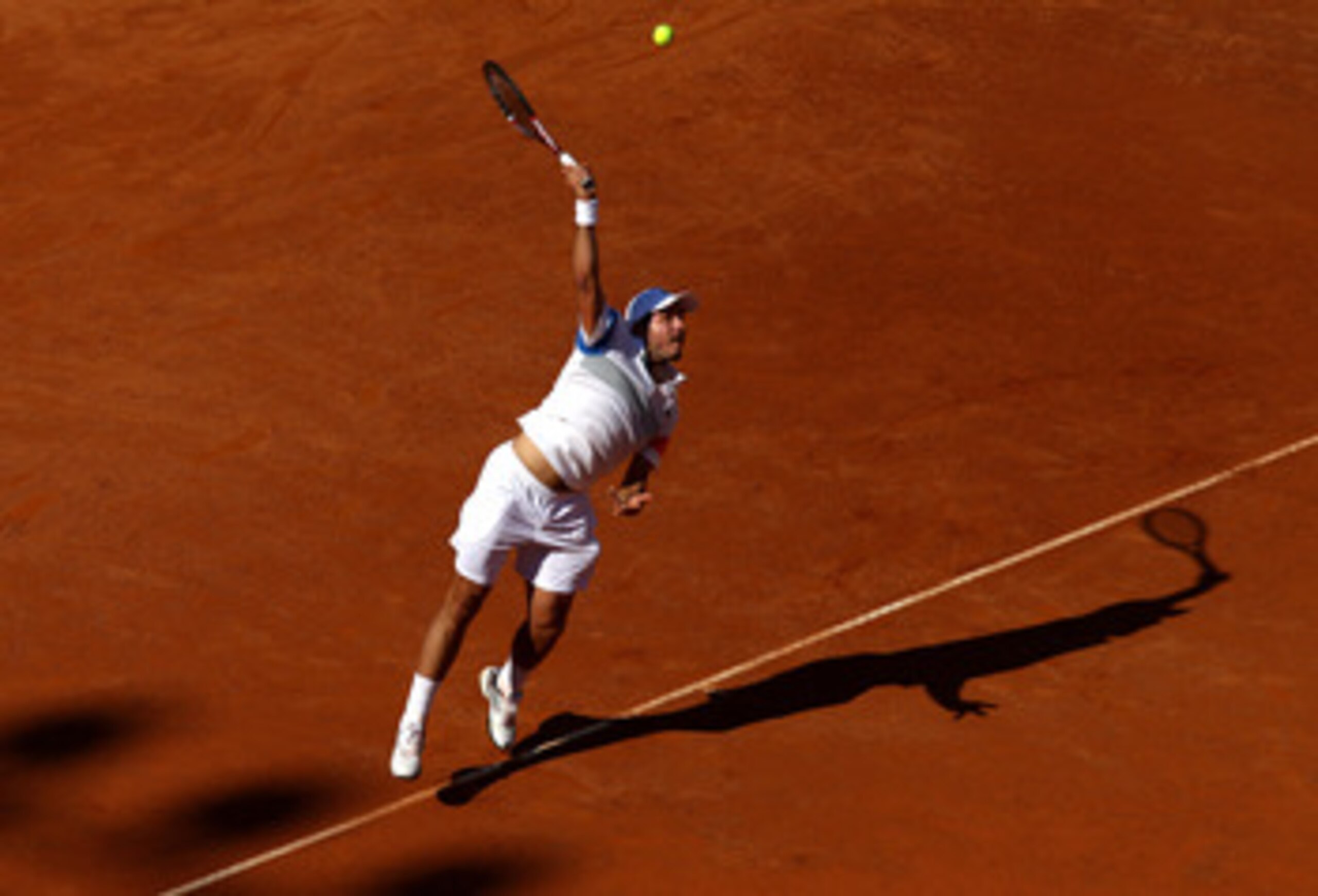 ROME, ITALY - MAY 10:  Stanislav Wawrinka of Switzerland serves during his first round match against Fabio Fognini of Italy during day three of the Internazionali BNL d'Italia at the Foro Italico Tennis Centre on May 10, 2011 in Rome, Italy.  (Photo by Al