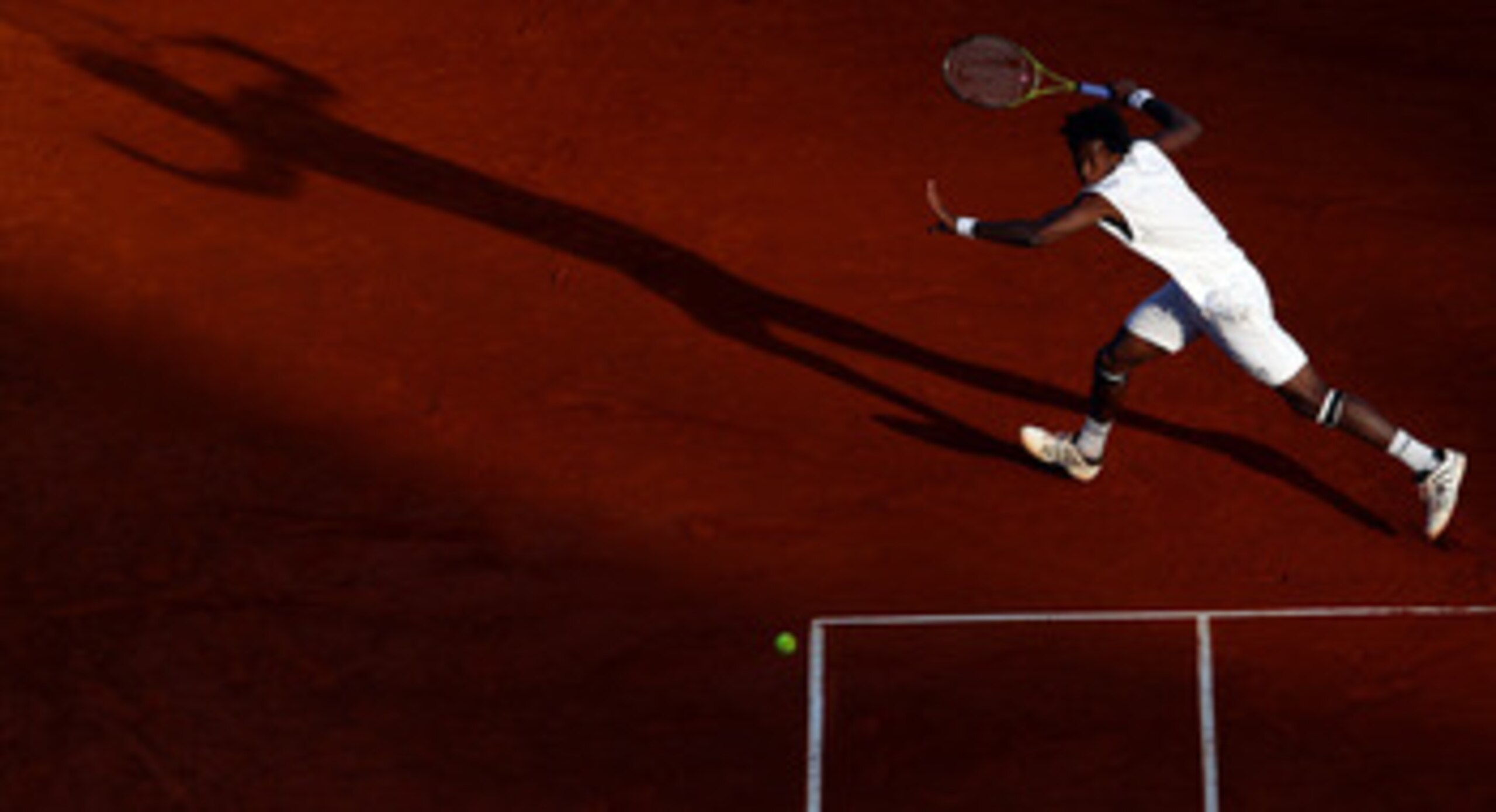 MONACO - APRIL 13:  Gael Monfils of France in action with partner (out of frame) Jo-Wilfried Tsonga of France in their doubles match against Lukas Dlouhy of Czech Republic and Janko Tipsarevic of Serbia during Day Four of the ATP Masters Series Tennis at 