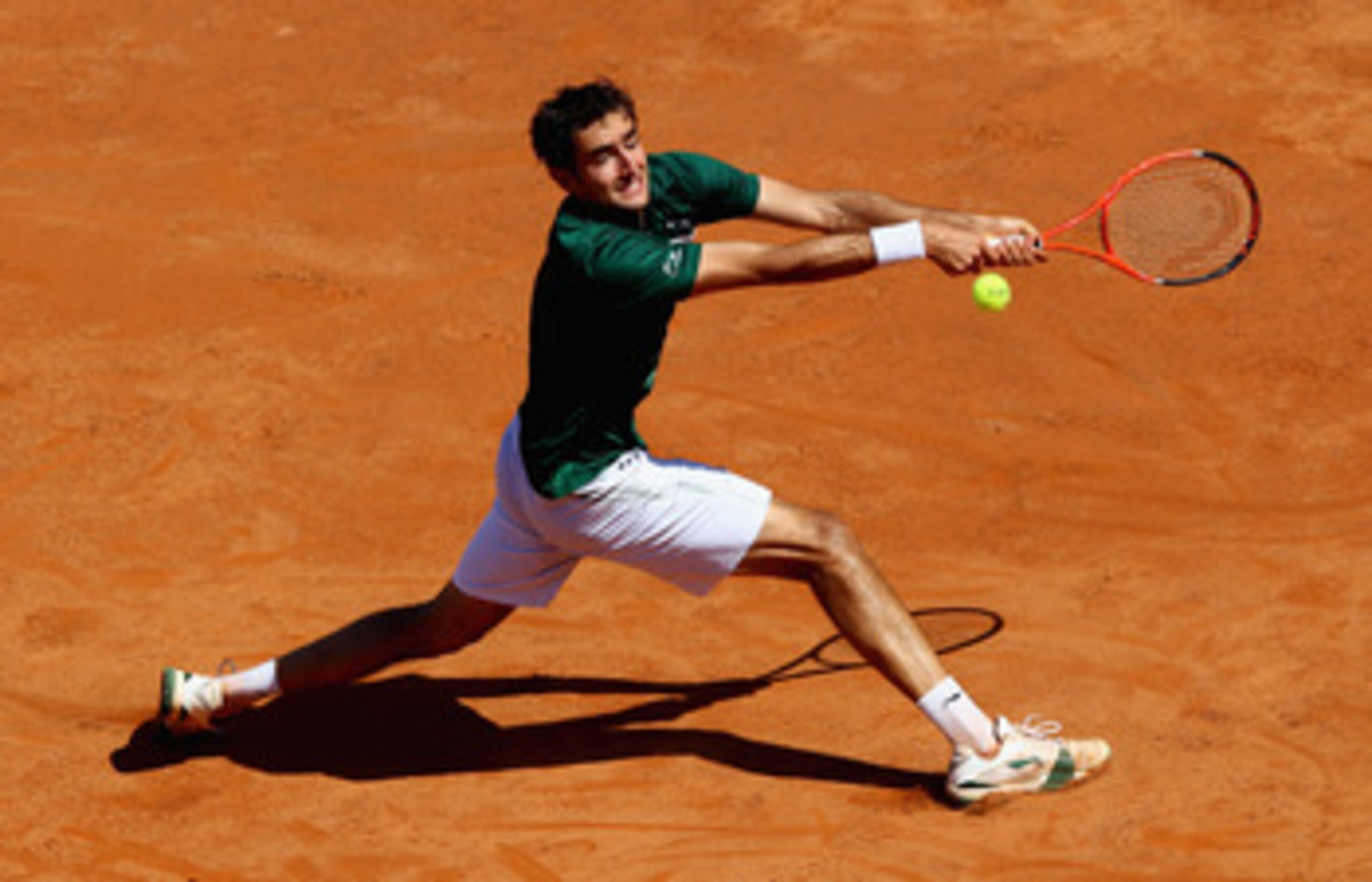 ROME, ITALY - MAY 13: Marin Cilic of Croatia stretches to play a backhand during his quarter final match against Rafael Nadal of Spain during day six of the Internazoinali BNL D'Italia at the Foro Italico Tennis Centre  on May 13, 2011 in Rome, Italy.  (P