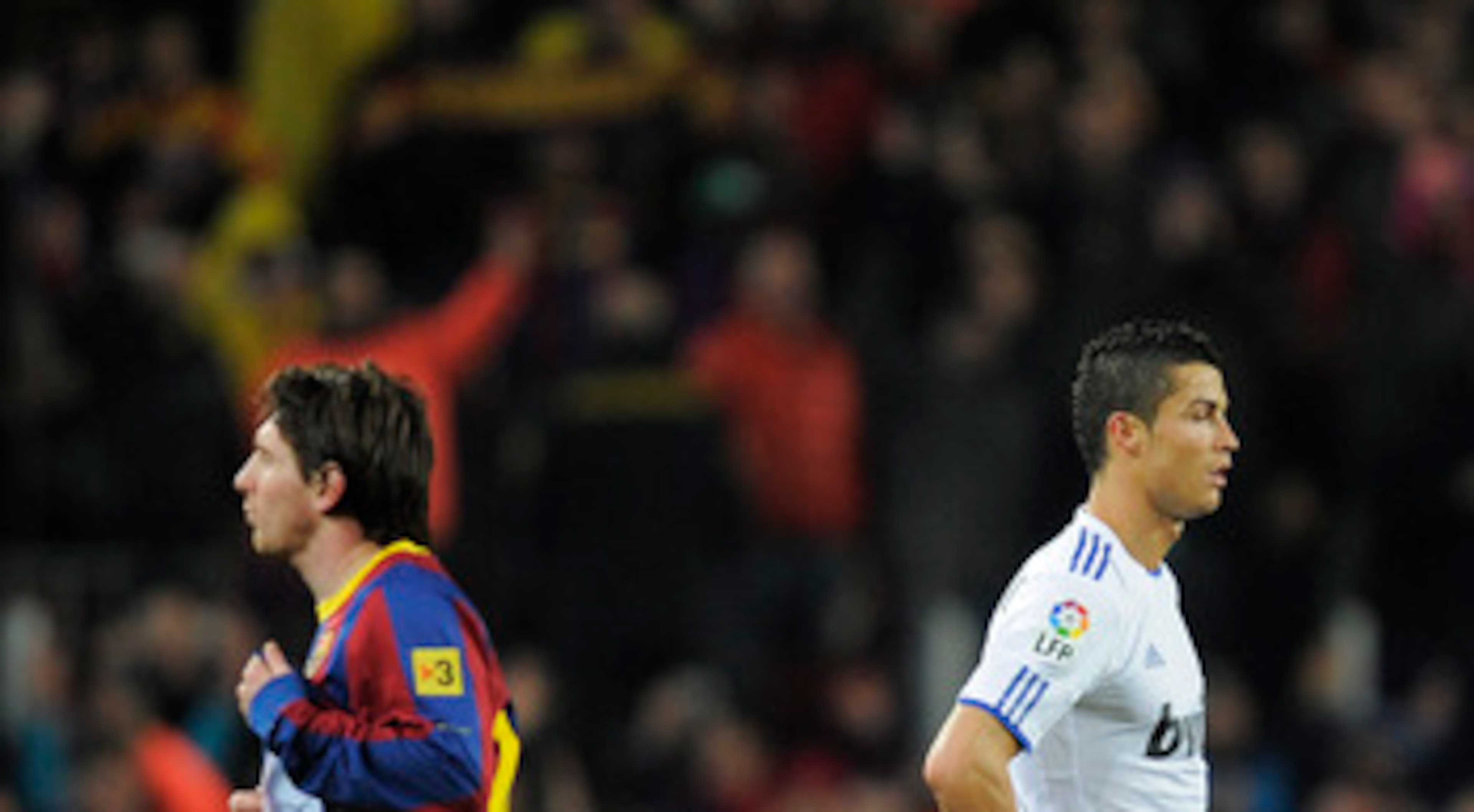 BARCELONA, SPAIN - NOVEMBER 29:  Cristiano Ronaldo of Real Madrid (R) and Lionel Messi of FC Barcelona look on during the La Liga match between Barcelona and Real Madrid at the Camp Nou Stadium on November 29, 2010 in Barcelona, Spain.  Barcelona won the 