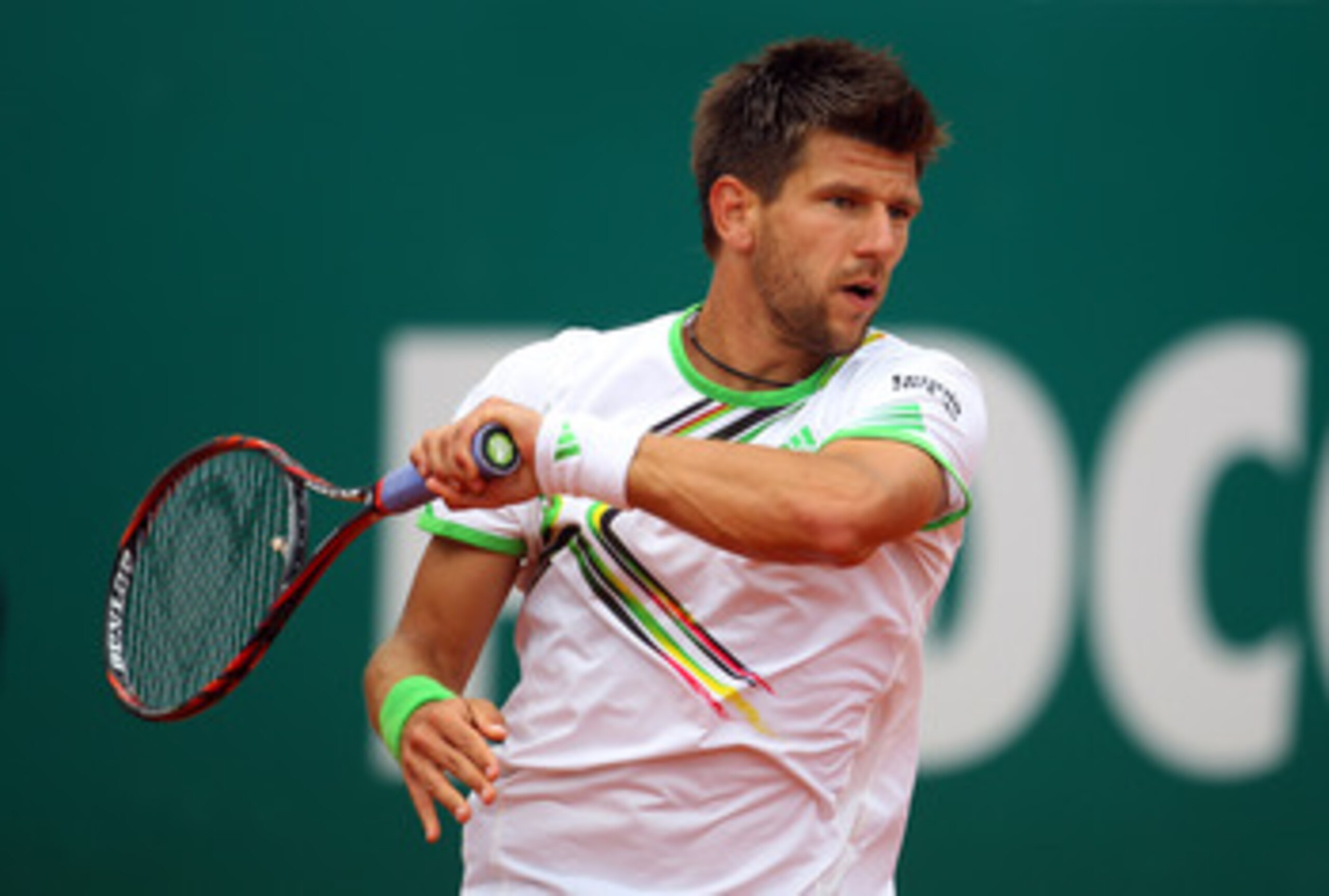 MONACO - APRIL 15:  Jurgen Melzer of Austria plays a forehand in his match against Roger Federer of Switzerland during Day Six of the ATP Masters Series Tennis at the Monte Carlo Country Club on April 15, 2011 in Monte Carlo, Monaco.  (Photo by Julian Fin