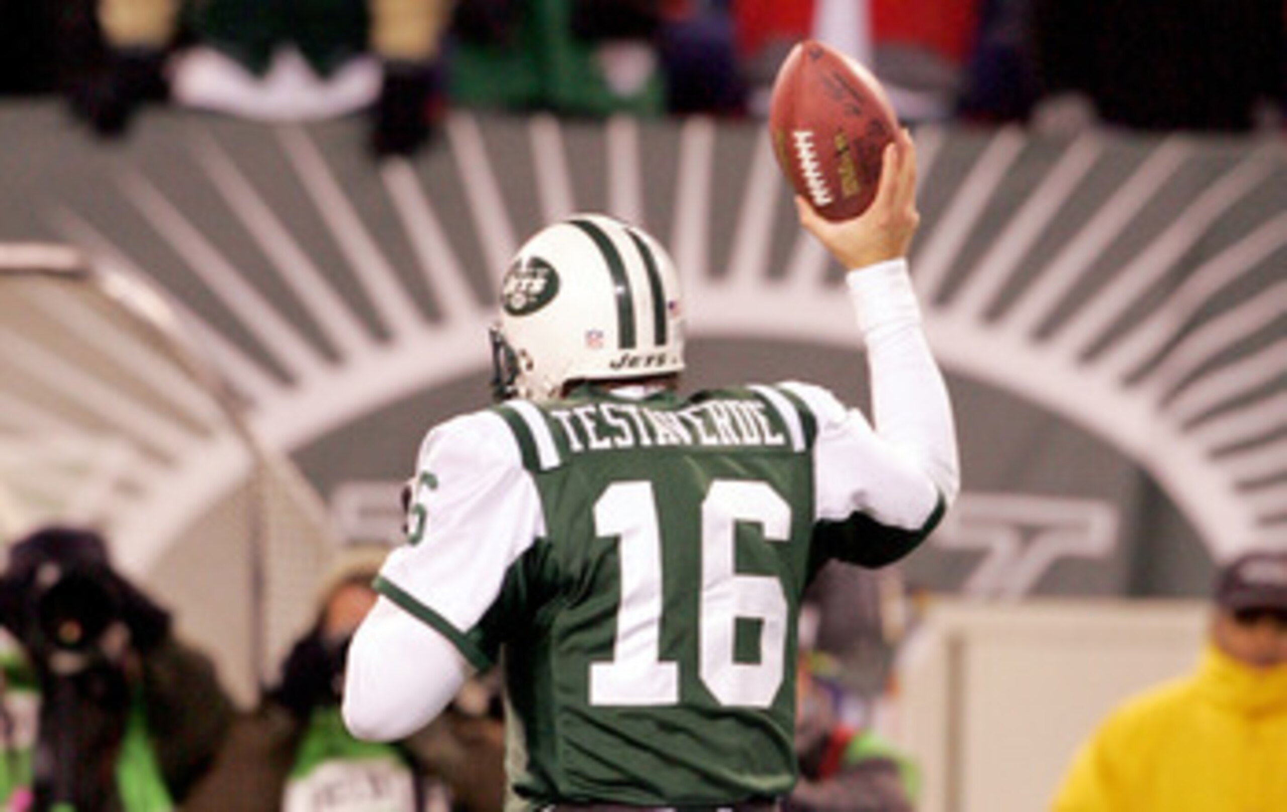 EAST RUTHERFORD, NJ - DECEMBER 26:  Vinny Testaverde #16 of the New York Jets runs off the field holding the ball he threw for a touchdown to teammate Laveranues Coles against the New England Patriots on December 26, 2005 at Giants Stadium in East Rutherf
