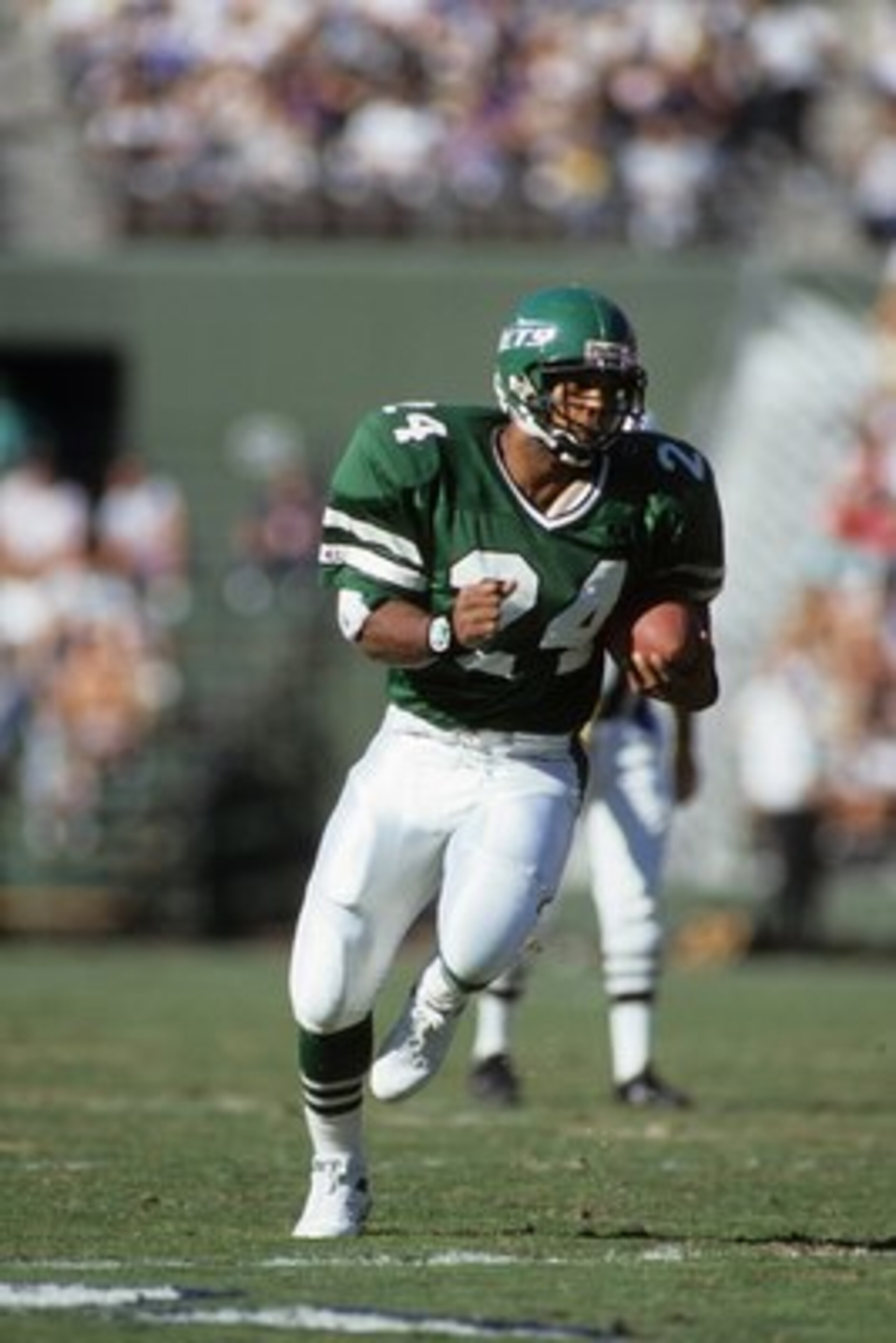SAN DIEGO, CA - DECEMBER 2:  Running back Freeman McNeil #24 of the New York Jets runs the ball during a game against the San Diego Chargers at Jack Murphy Stadium on December 2, 1990 in San Diego, California.  The San Diego Chargers won 38-17  (Photo by 