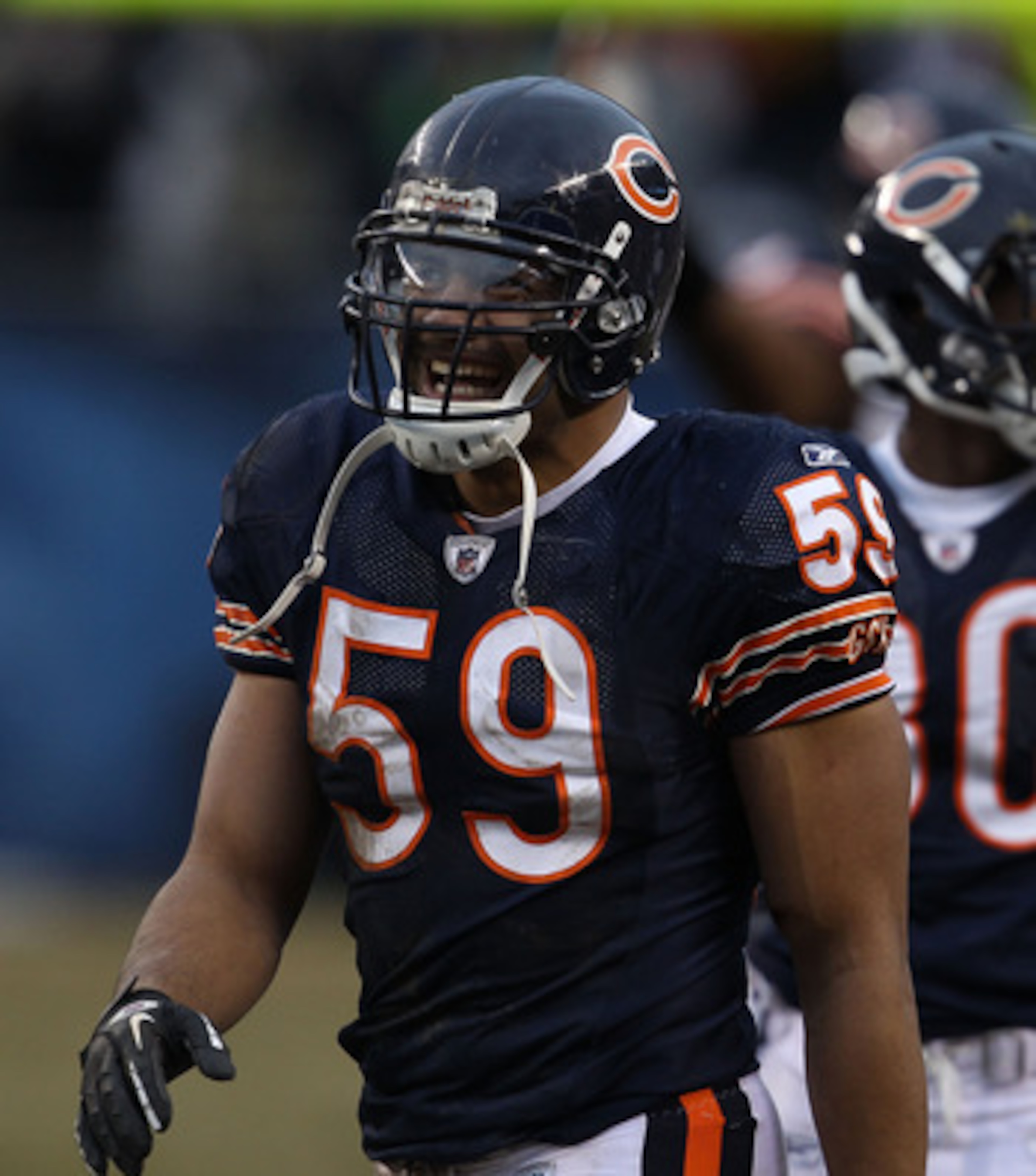 CHICAGO, IL - DECEMBER 26: Pisa Tinoisamoa #59 of the Chicago Bears smiles after teammate Chris Harris intercepted a pass in the final minutes against the New York Jets at Soldier Field on December 26, 2010 in Chicago, Illinois. The Bears defeated the Jet