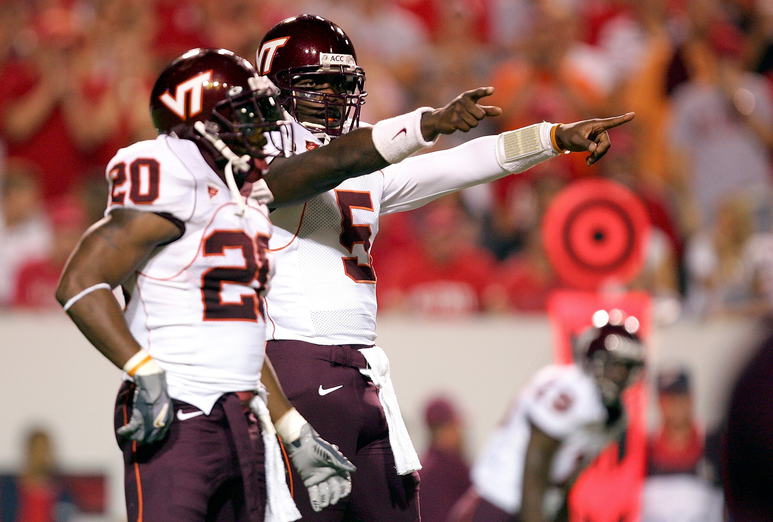 RALEIGH, NC - SEPTEMBER 4: Quarterback Marcus Vick #5 and tailback Mike Imoh #20 of the Virginia Tech Hokies point down field during their game against the North Carolina State Wolfpack at Carter-Finley Stadium on September 4, 2005 in Raleigh, North Caro RALEIGH, NC - SEPTEMBER 4: Quarterback Marcus Vick #5 and tailback Mike Imoh #20 of the Virginia Tech Hokies point down field during their game against the North Carolina State Wolfpack at Carter-Finley Stadium on September 4, 2005 in Raleigh, North Caro