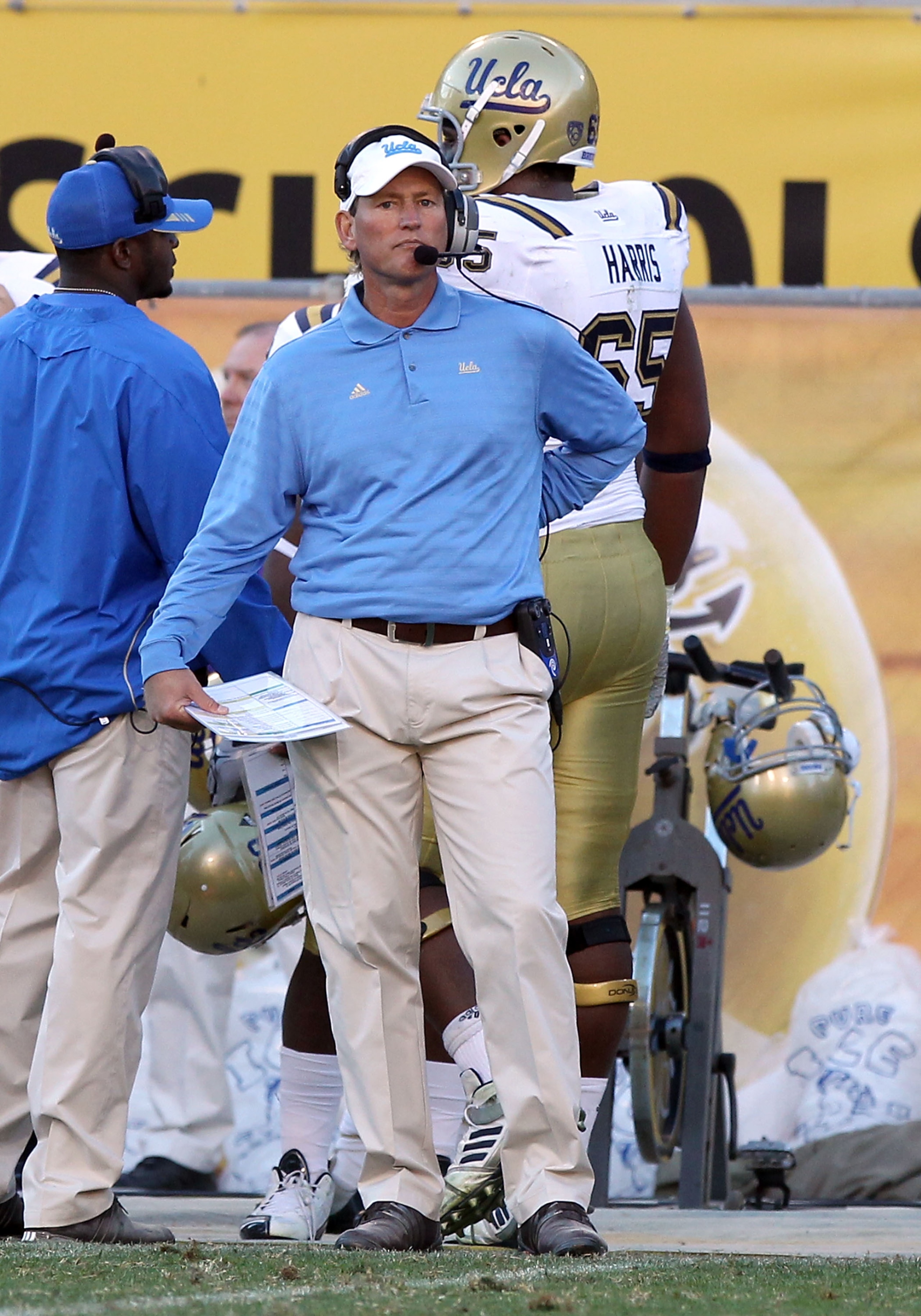 TEMPE, AZ - NOVEMBER 26: Head coach Rick Neuheisel of the UCLA Bruins watches from the sidelines during the college football game against the Arizona State Sun Devils at Sun Devil Stadium on November 26, 2010 in Tempe, Arizona. The Sun Devils defeated th TEMPE, AZ - NOVEMBER 26: Head coach Rick Neuheisel of the UCLA Bruins watches from the sidelines during the college football game against the Arizona State Sun Devils at Sun Devil Stadium on November 26, 2010 in Tempe, Arizona. The Sun Devils defeated th
