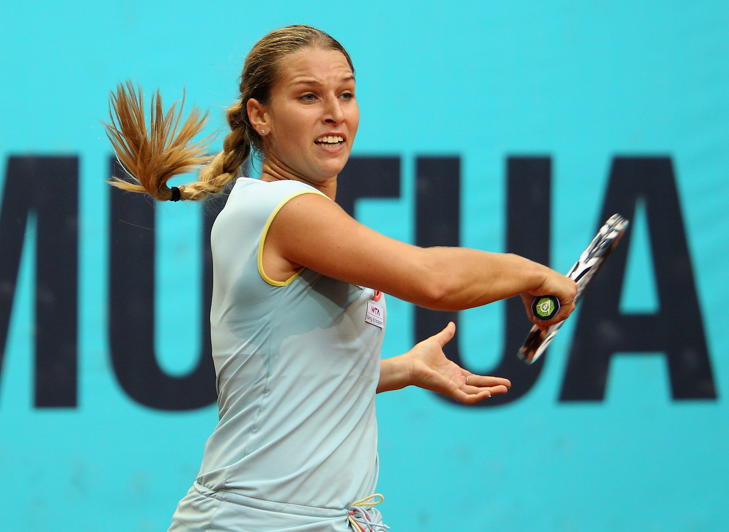 MADRID, SPAIN - MAY 06:  Dominika Cibulkova of Slovakia plays a forehand in her match against Petra Kvitova of Czech Republic during day seven of the Mutua Madrilena Madrid Open Tennis on May 6, 2011 in Madrid, Spain.  (Photo by Julian Finney/Getty Images