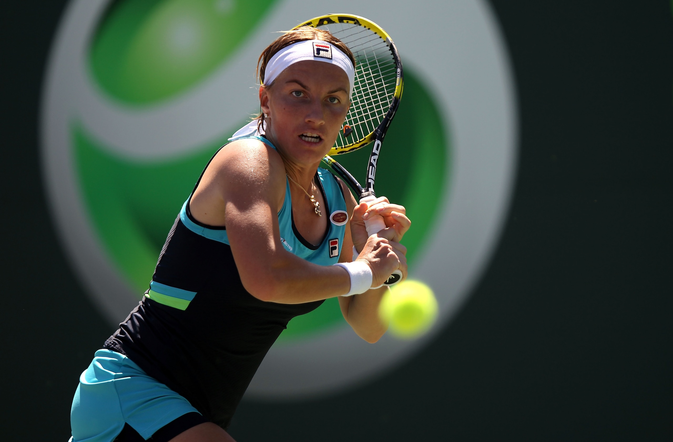 KEY BISCAYNE, FL - MARCH 26:  Svetlana Kuznetsova of Russia chases down the ball against Shuai Peng of China during the Sony Ericsson Open at Crandon Park Tennis Center on March 26, 2011 in Key Biscayne, Florida.  (Photo by Clive Brunskill/Getty Images)