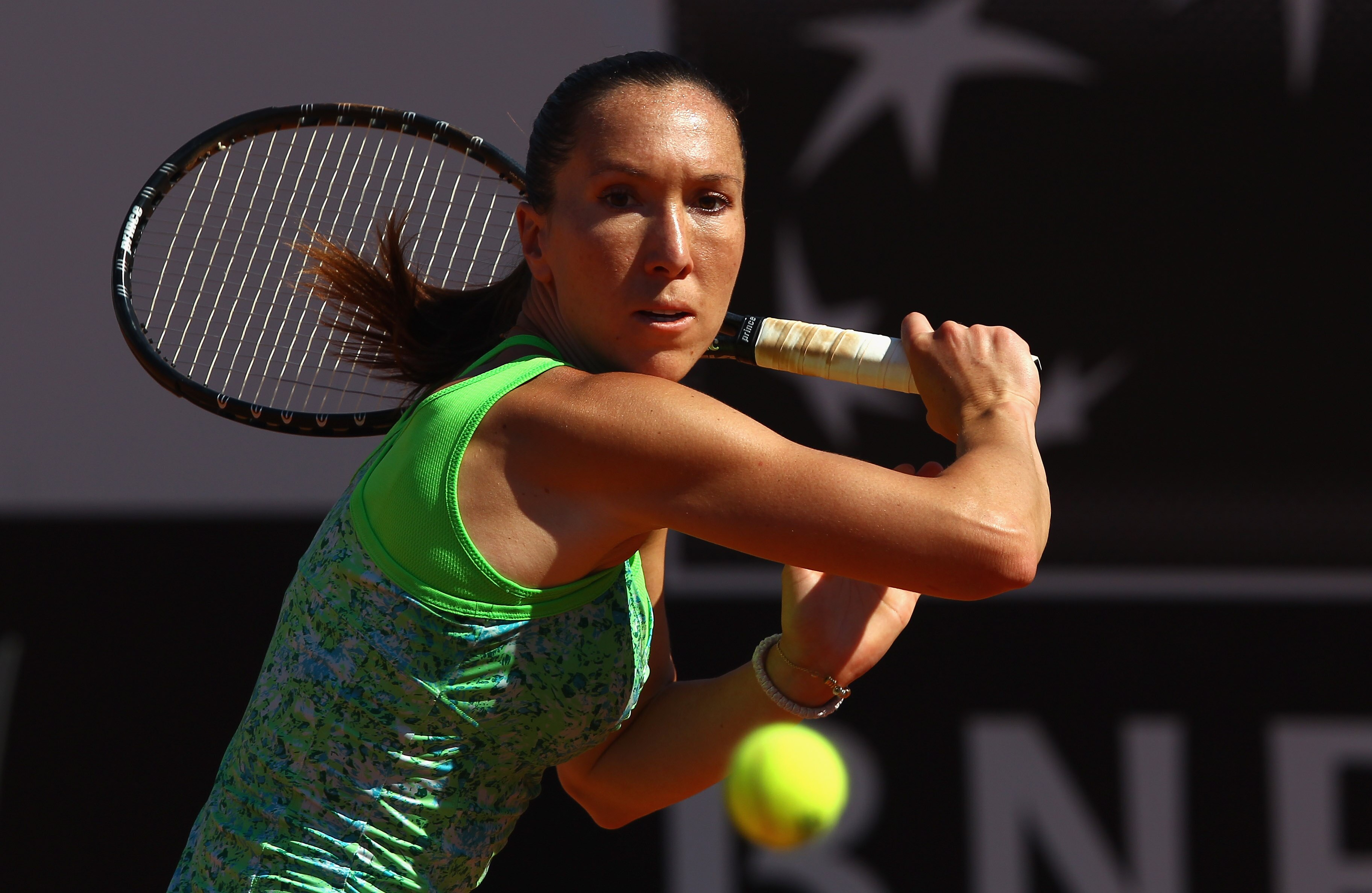 ROME, ITALY - MAY 13:  Jelena Jankovic of Serbia runs to play a backhand during her quarter final match against Caroline Wozniacki of Denmark during day six of the Internazoinali BNL D'Italia at the Foro Italico Tennis Centre  on May 13, 2011 in Rome, Ita