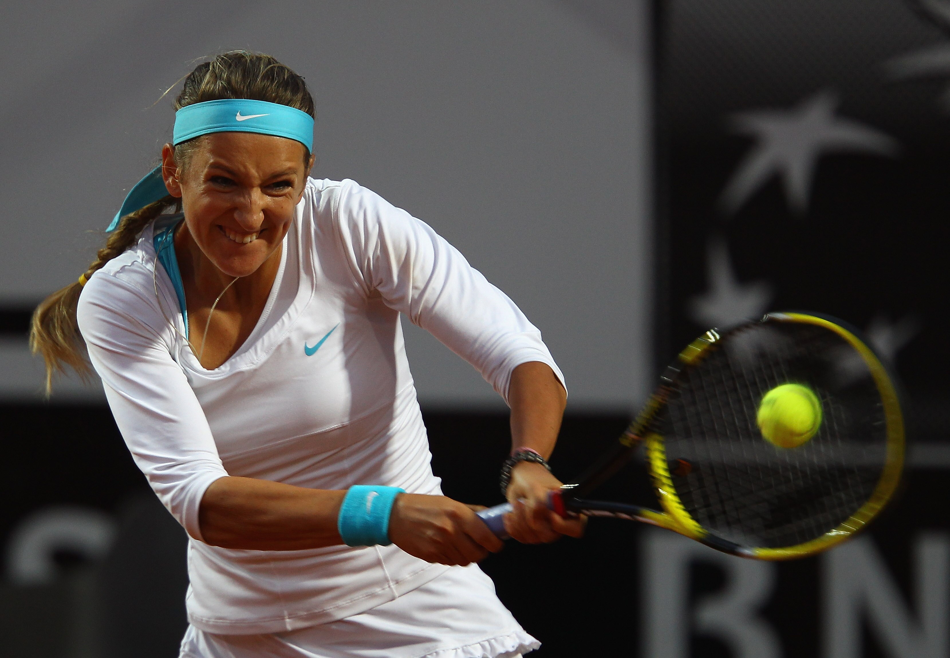 ROME, ITALY - MAY 13:  Victoria Azarenka of Belarus  plays a backhand during her quarter final match against Maria Sharapova of Russia during day six of the Internazoinali BNL D'Italia at the Foro Italico Tennis Centre  on May 13, 2011 in Rome, Italy.  (P