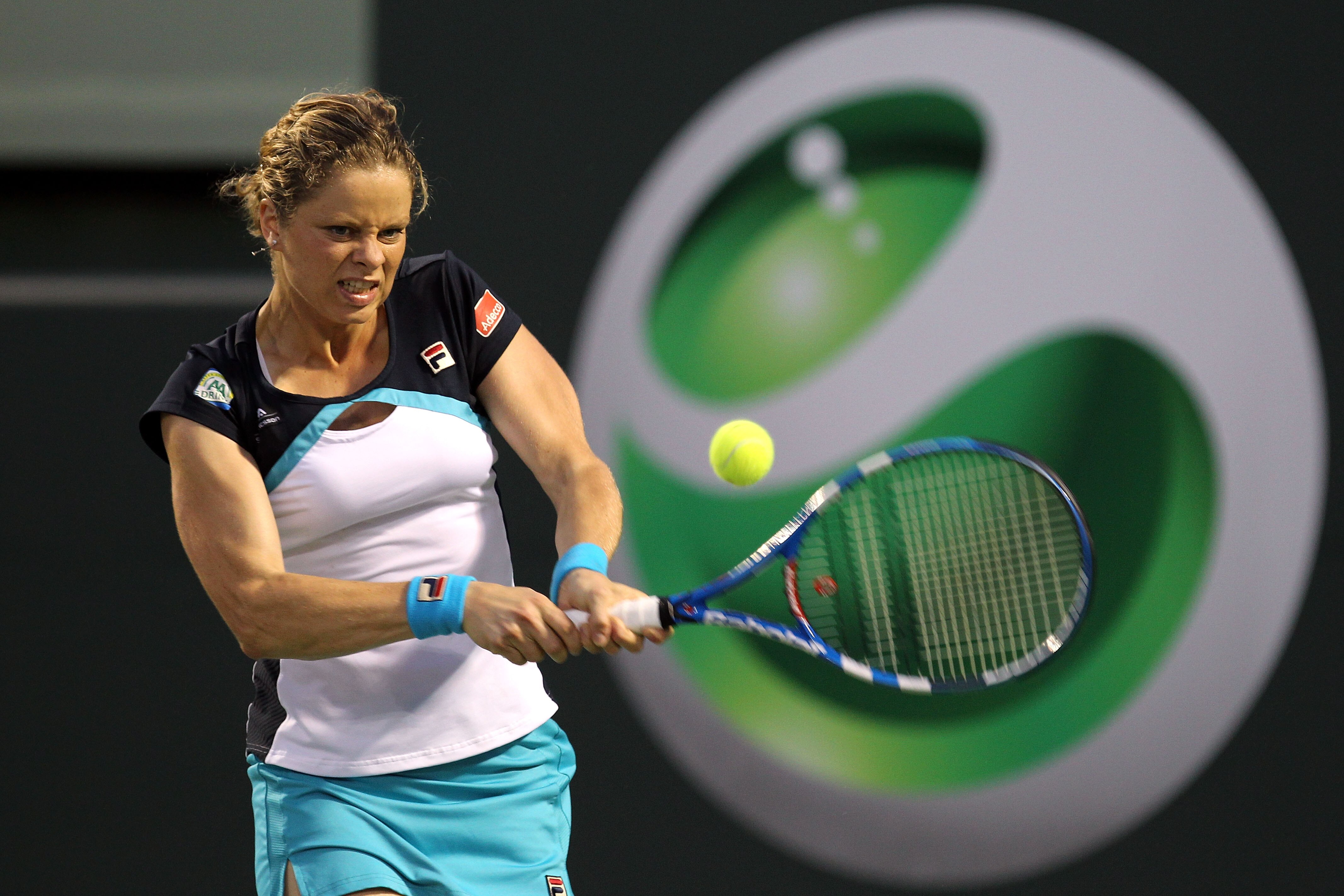 KEY BISCAYNE, FL - MARCH 30:  Kim Clijsters of Belgium hits a backhand return against Victoria Azarenka of Belarus during the Sony Ericsson Open at Crandon Park Tennis Center on March 30, 2011 in Key Biscayne, Florida.  (Photo by Al Bello/Getty Images)