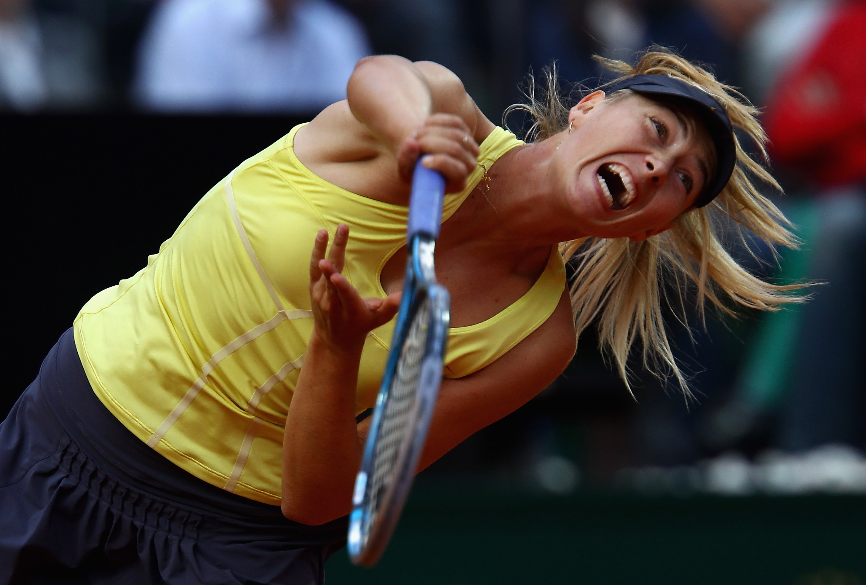 ROME, ITALY - MAY 15:  Maria Sharapova of Russia serves during the final against Samantha Stosur of Australia during day eight of the Internazoinali BNL D'Italia at the Foro Italico Tennis Centre on May 15, 2011 in Rome, Italy.  (Photo by Clive Brunskill/