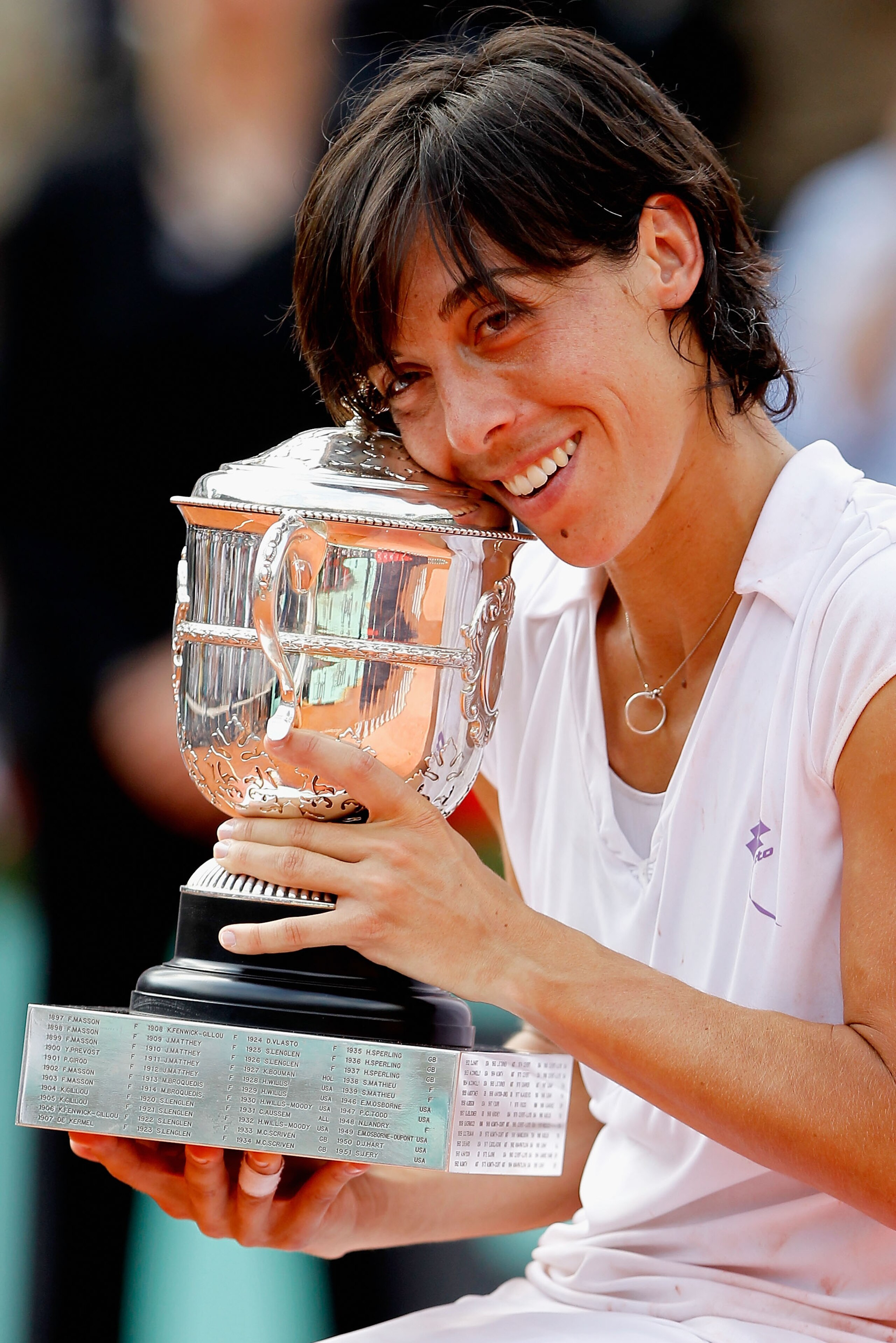 PARIS - JUNE 05:  Francesca Schiavone of Italy celebrates with the trophy after winning the women's singles final match between Francesca Schiavone of Italy and Samantha Stosur of Australia on day fourteen of the French Open at Roland Garros on June 5, 20