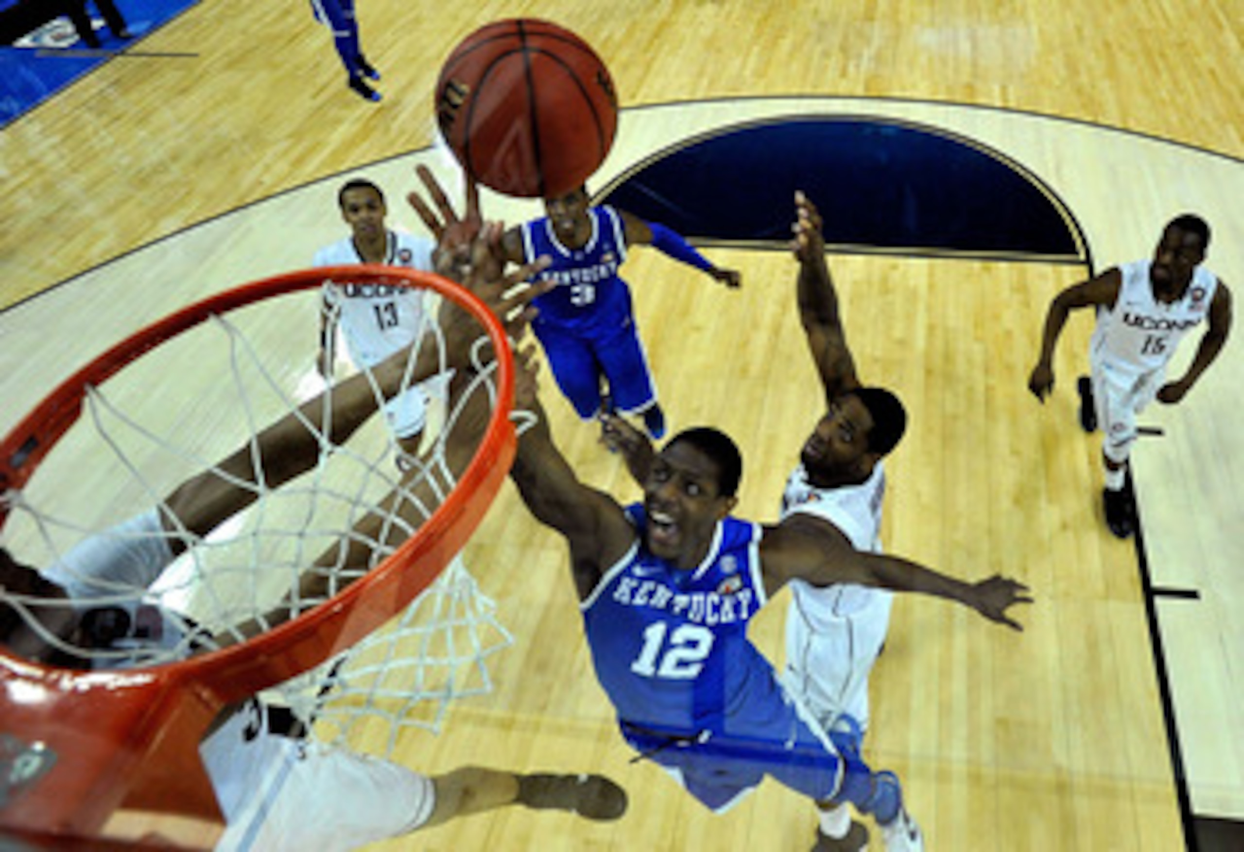 HOUSTON, TX - APRIL 02:  Brandon Knight #12 of the Kentucky Wildcats goes to the hoop against Alex Oriakhi #34 of the Connecticut Huskies during the National Semifinal game of the 2011 NCAA Division I Men's Basketball Championship at Reliant Stadium on Ap