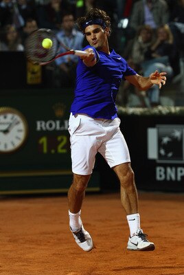 ROME, ITALY - MAY 11:  Roger Federer of Switzerland plays a forehand during his second round match against Jo-Wilfried Tsonga of France during day four of the Internazoinali BNL D'Italia at the Foro Italico Tennis Centre on May 11, 2011 in Rome, Italy.  (