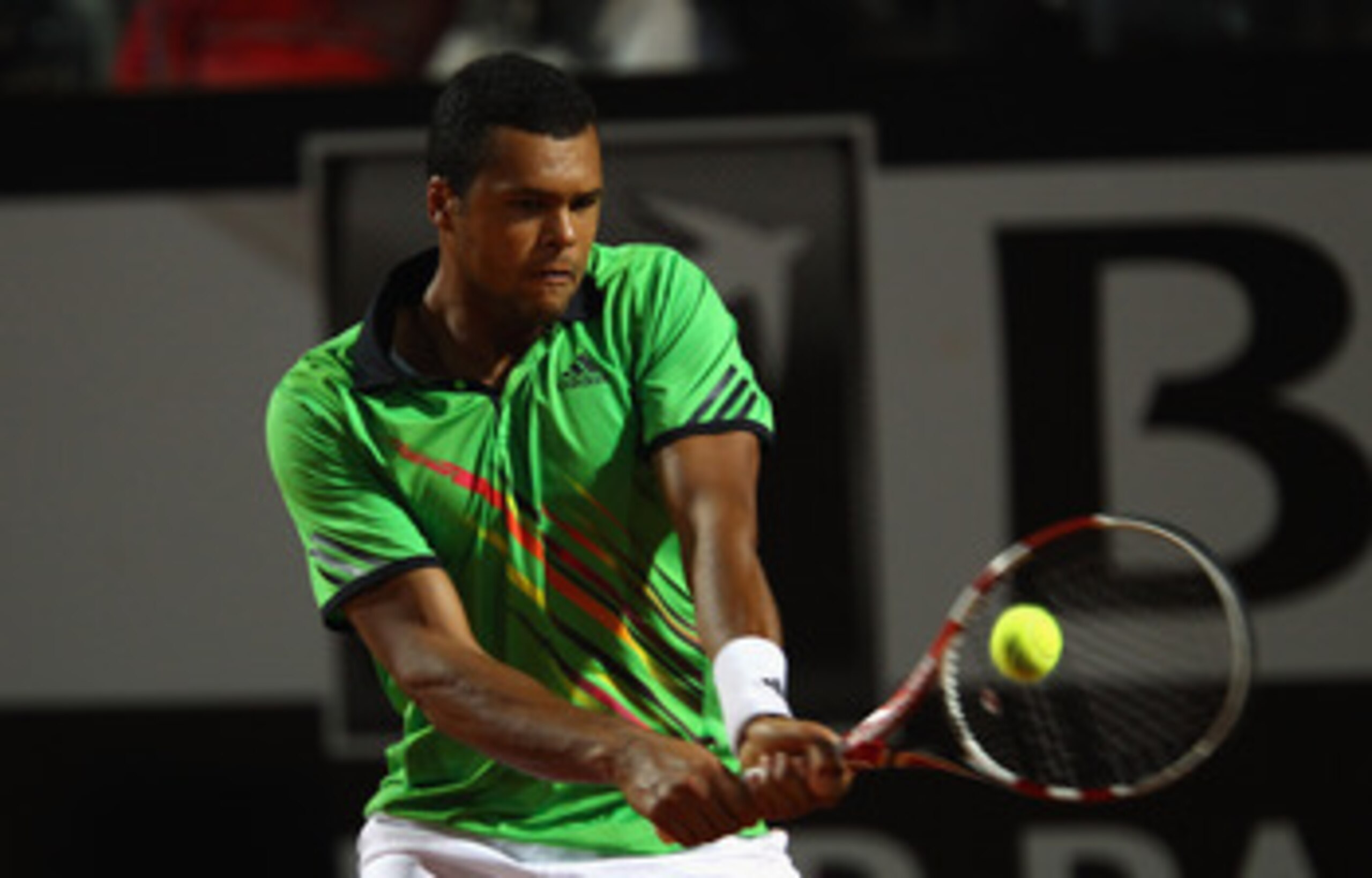 ROME, ITALY - MAY 11: Jo-Wilfried Tsonga of France plays a backhand during his second round match against Roger Federer of Switzerland during day four of the Internazoinali BNL D'Italia at the Foro Italico Tennis Centre on May 11, 2011 in Rome, Italy. ( ROME, ITALY - MAY 11: Jo-Wilfried Tsonga of France plays a backhand during his second round match against Roger Federer of Switzerland during day four of the Internazoinali BNL D'Italia at the Foro Italico Tennis Centre on May 11, 2011 in Rome, Italy. (