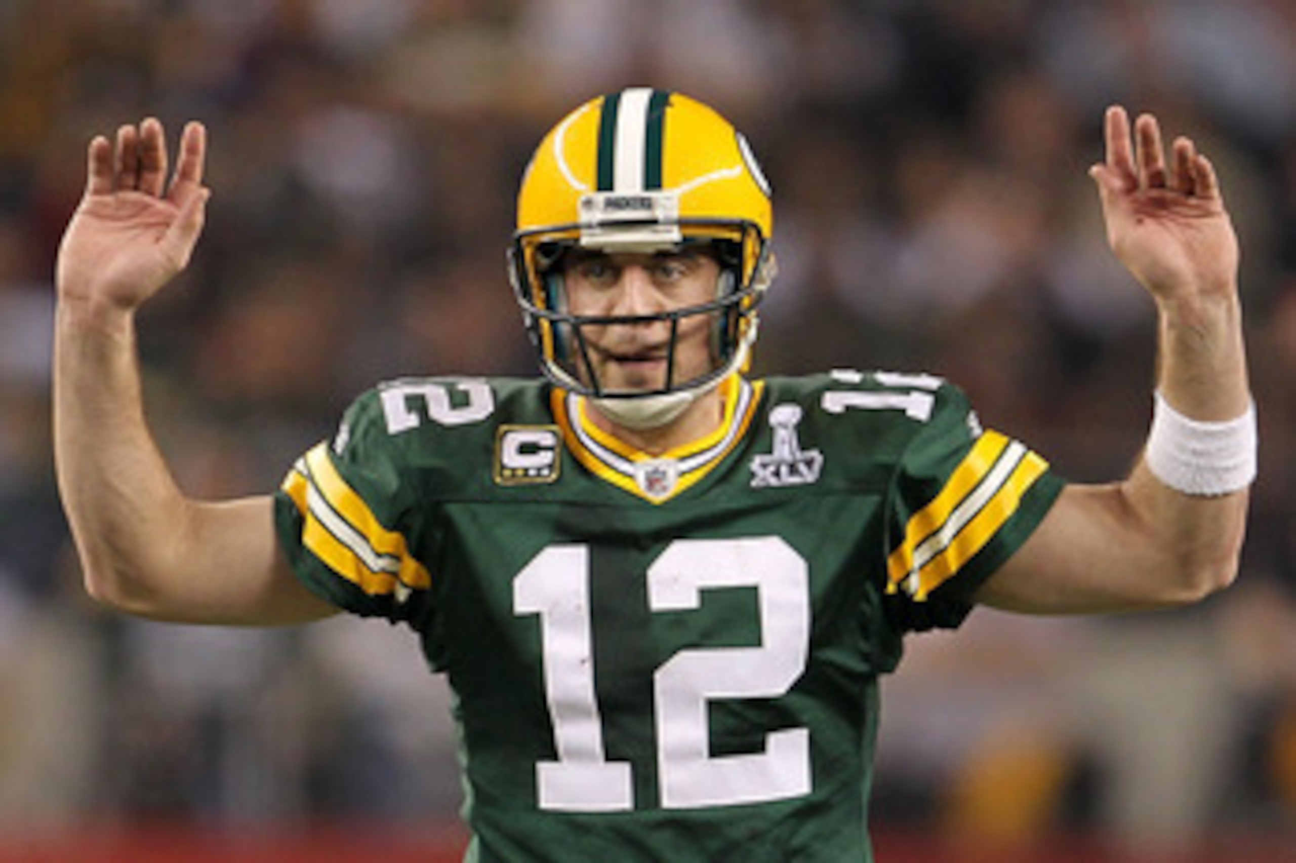 ARLINGTON, TX - FEBRUARY 06:  Quarterback Aaron Rodgers #12 of the Green Bay Packers calls out from under center against the Pittsburgh Steelers during Super Bowl XLV at Cowboys Stadium on February 6, 2011 in Arlington, Texas.  (Photo by Jamie Squire/Gett