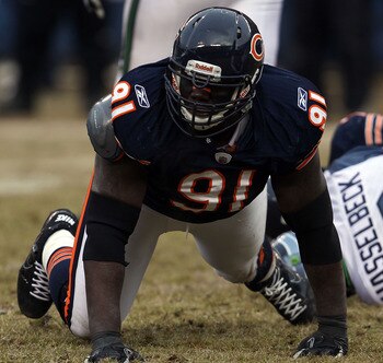CHICAGO, IL - JANUARY 16:  Tommie Harris #91 of the Chicago Bears reacts after a sack of quarterback Matt Hasselbeck #8 of the Seattle Seahawks in the 2011 NFC divisional playoff game at Soldier Field on January 16, 2011 in Chicago, Illinois.  (Photo by J