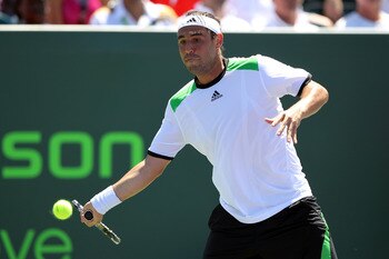 KEY BISCAYNE, FL - MARCH 26:  Marcos Baghdatis of Cyprus returns against Oliver Rochus of Belgium during the Sony Ericsson Open at Crandon Park Tennis Center on March 26, 2011 in Key Biscayne, Florida.  (Photo by Al Bello/Getty Images)