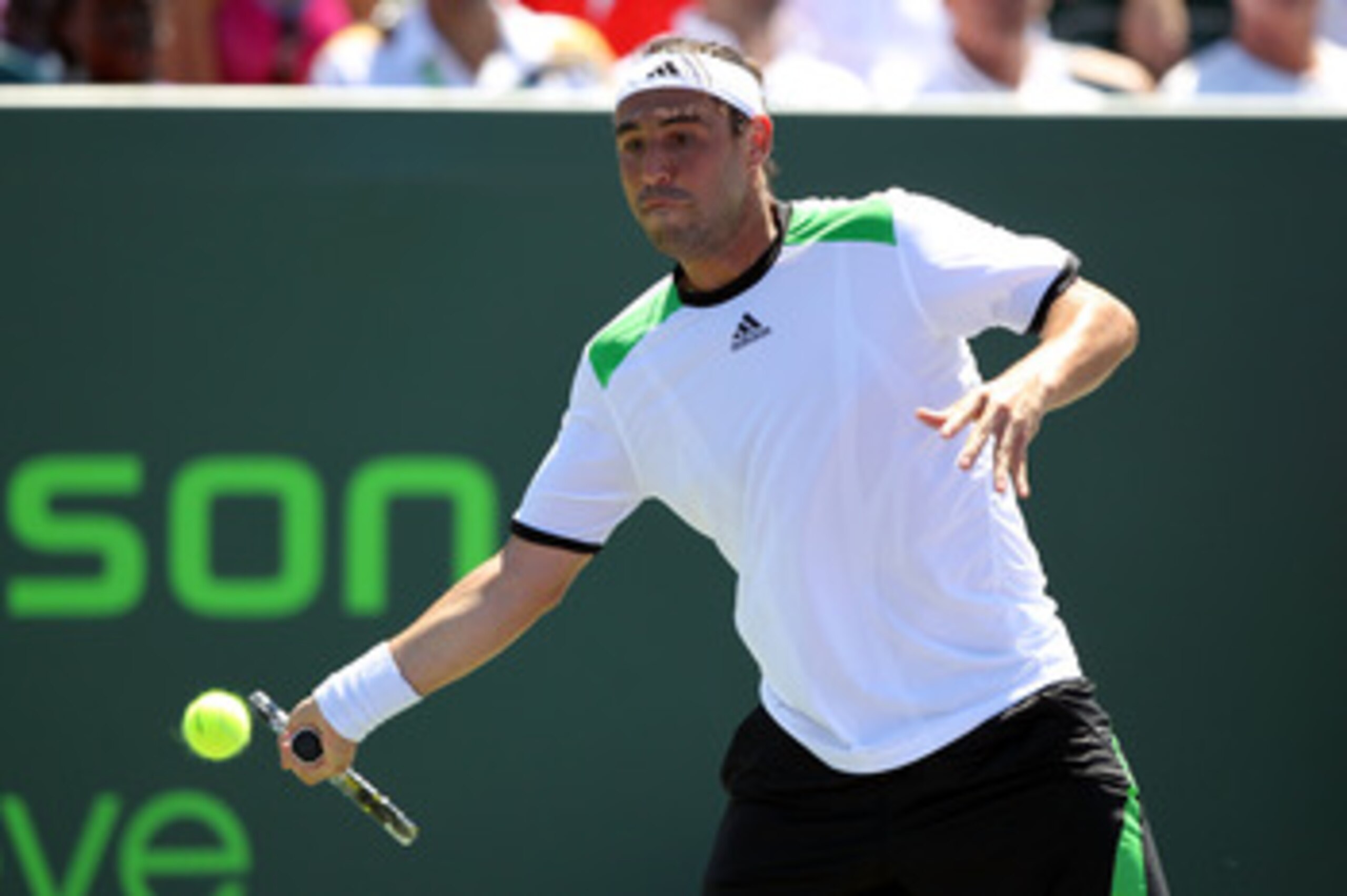 KEY BISCAYNE, FL - MARCH 26: Marcos Baghdatis of Cyprus returns against Oliver Rochus of Belgium during the Sony Ericsson Open at Crandon Park Tennis Center on March 26, 2011 in Key Biscayne, Florida. (Photo by Al Bello/Getty Images) KEY BISCAYNE, FL - MARCH 26: Marcos Baghdatis of Cyprus returns against Oliver Rochus of Belgium during the Sony Ericsson Open at Crandon Park Tennis Center on March 26, 2011 in Key Biscayne, Florida. (Photo by Al Bello/Getty Images)