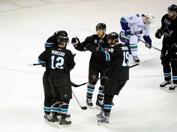 SAN JOSE, CA - MAY 20:  Patrick Marleau #12, Joe Pavelski #8, Joe Thornton #19 and Dany Heatley #15 of the San Jose Sharks celebrate teammate Dan Boyle #22 of the San Jose Sharks' goal in the third period as Mason Raymond #21 of the Vancouver Canucks hang
