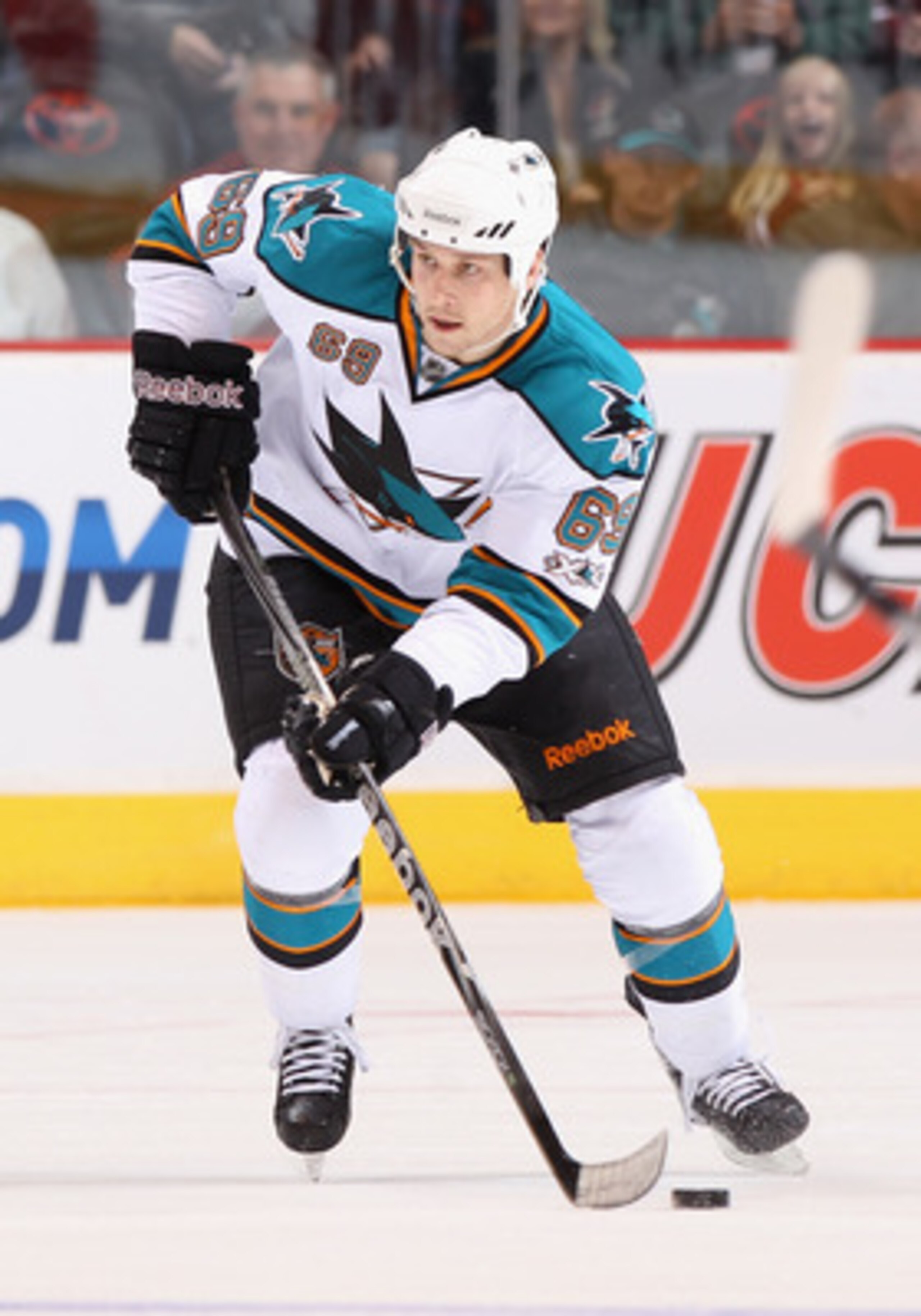 GLENDALE, AZ - MARCH 26:  Andrew Desjardins #69 of the San Jose Sharks skates with the puck during the NHL game against the Phoenix Coyotes at Jobing.com Arena on March 26, 2011 in Glendale, Arizona. The Sharks defeated the Coyotes 4-1.  (Photo by Christi