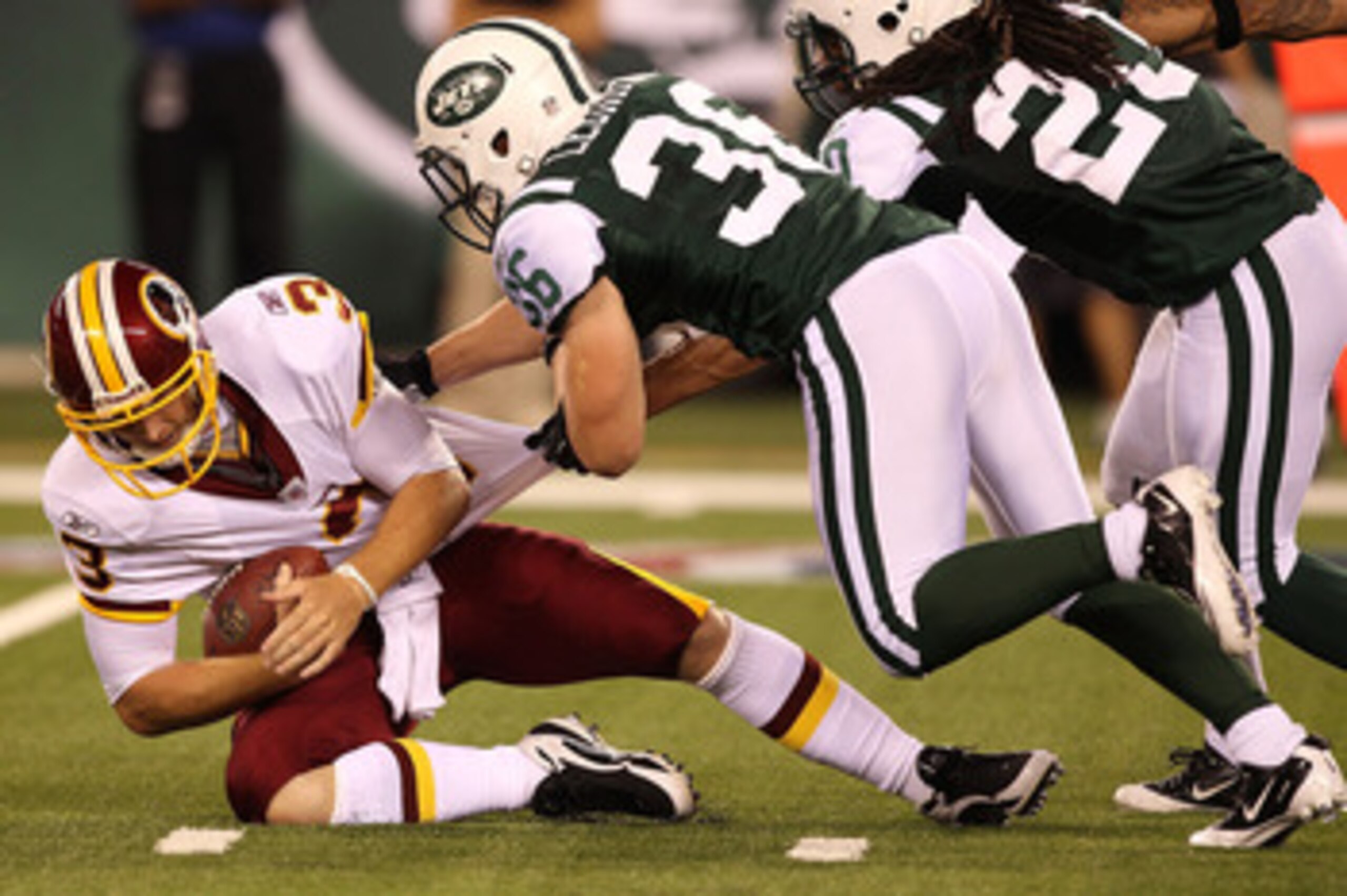 EAST RUTHERFORD, NJ - AUGUST 27:  Jim Leonhard #36 of the New York Jets sacks John Beck #3 of the Washington Redskins  during their preseason game on August 27, 2010 at the New Meadowlands Stadium  in East Rutherford, New Jersey.  (Photo by Al Bello/Getty