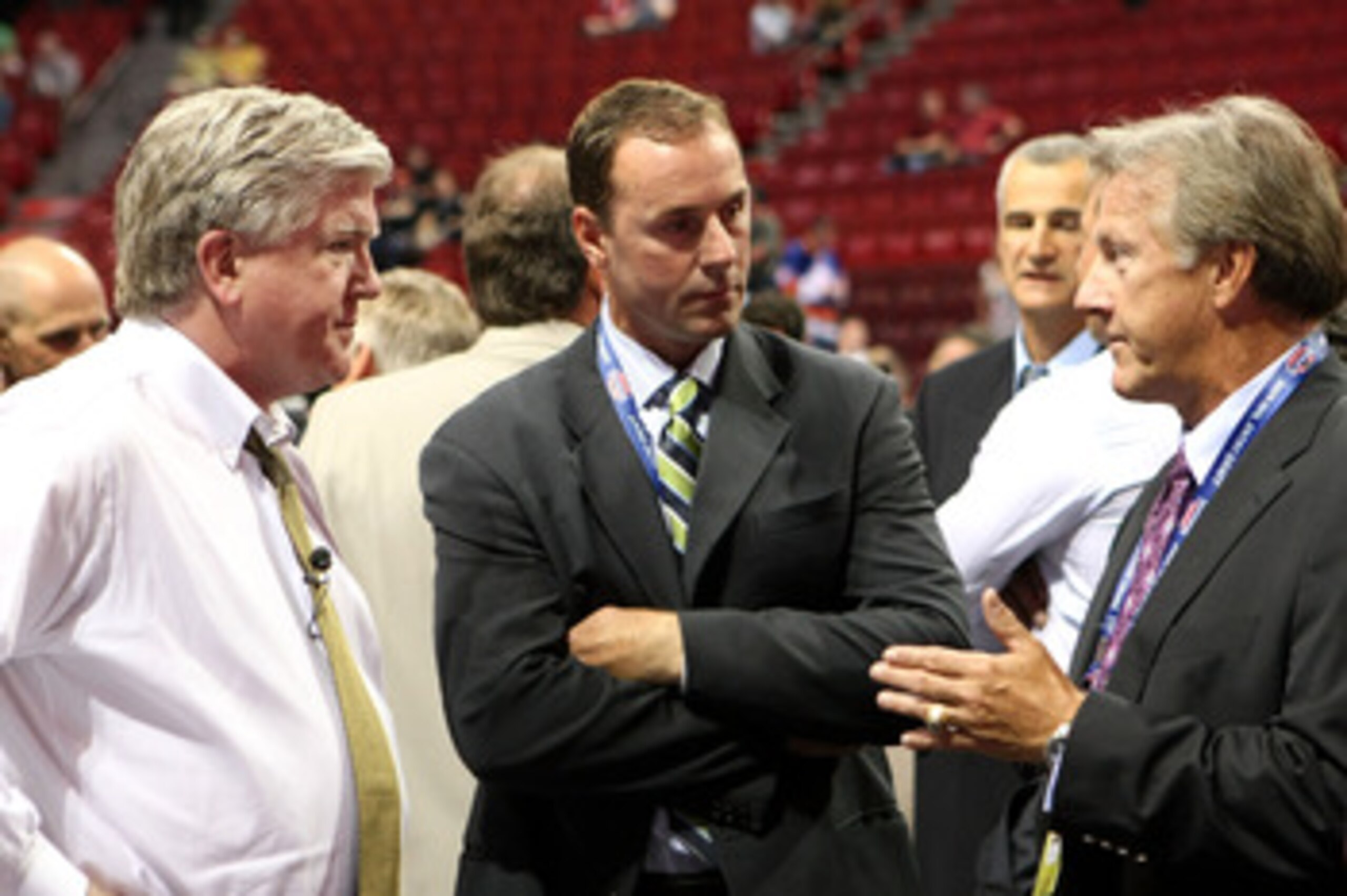 MONTREAL, QC - JUNE 26:  President & General Manager Brian Burke (L) and head coach Ron Wilson (R) of the Toronto Maple Leafs talk with Genral Manager Joe Nieuwendyk of the Dallas Stars prior to the first round of the 2009 NHL Entry Draft at the Bell Cent