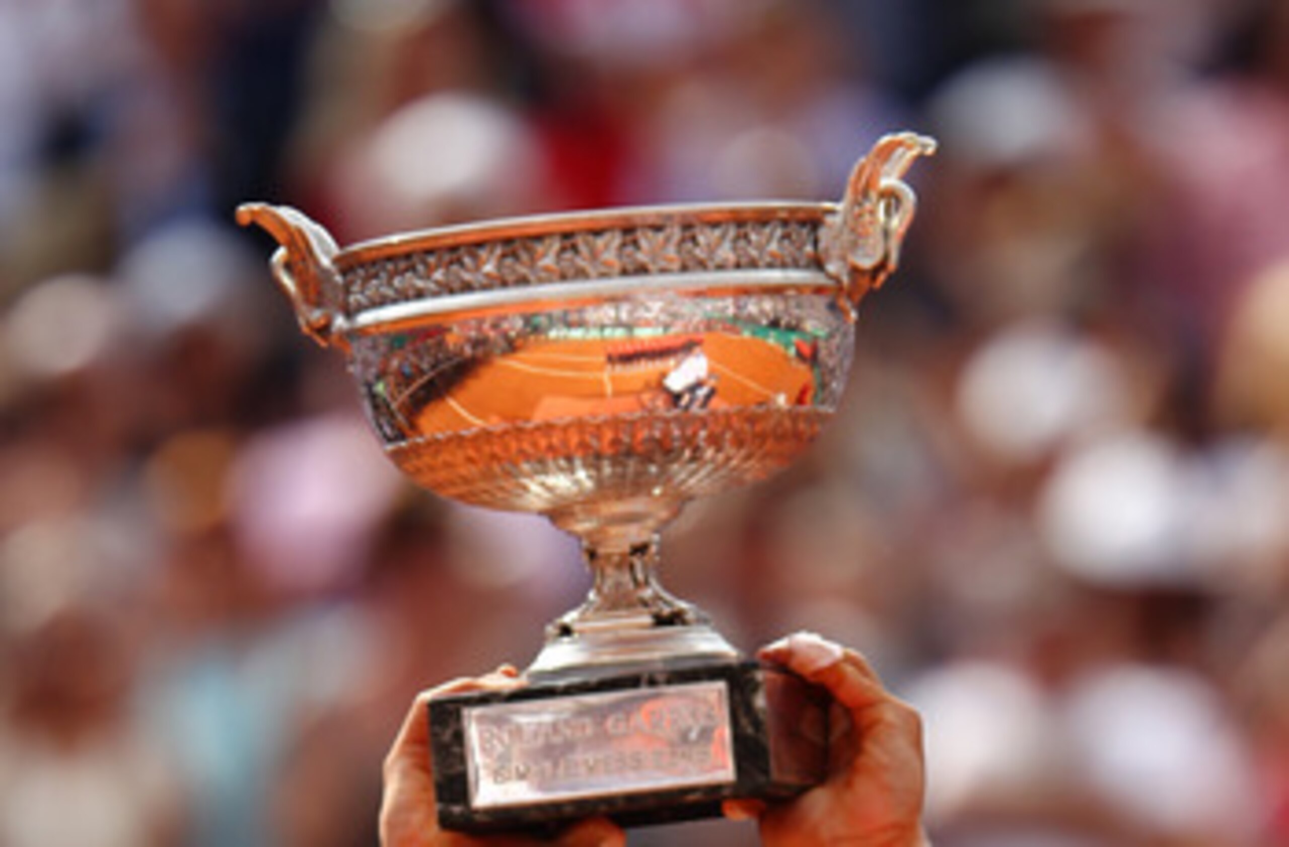 PARIS, FRANCE - MAY 22:  Jo-Wilfried Tsonga of France plays a backhand during the men's singles round one match between Jan Hajek of Czech Republic and Jo-Wilfried Tsonga of France on day one of the French Open at Roland Garros on May 22, 2011 in Paris, F