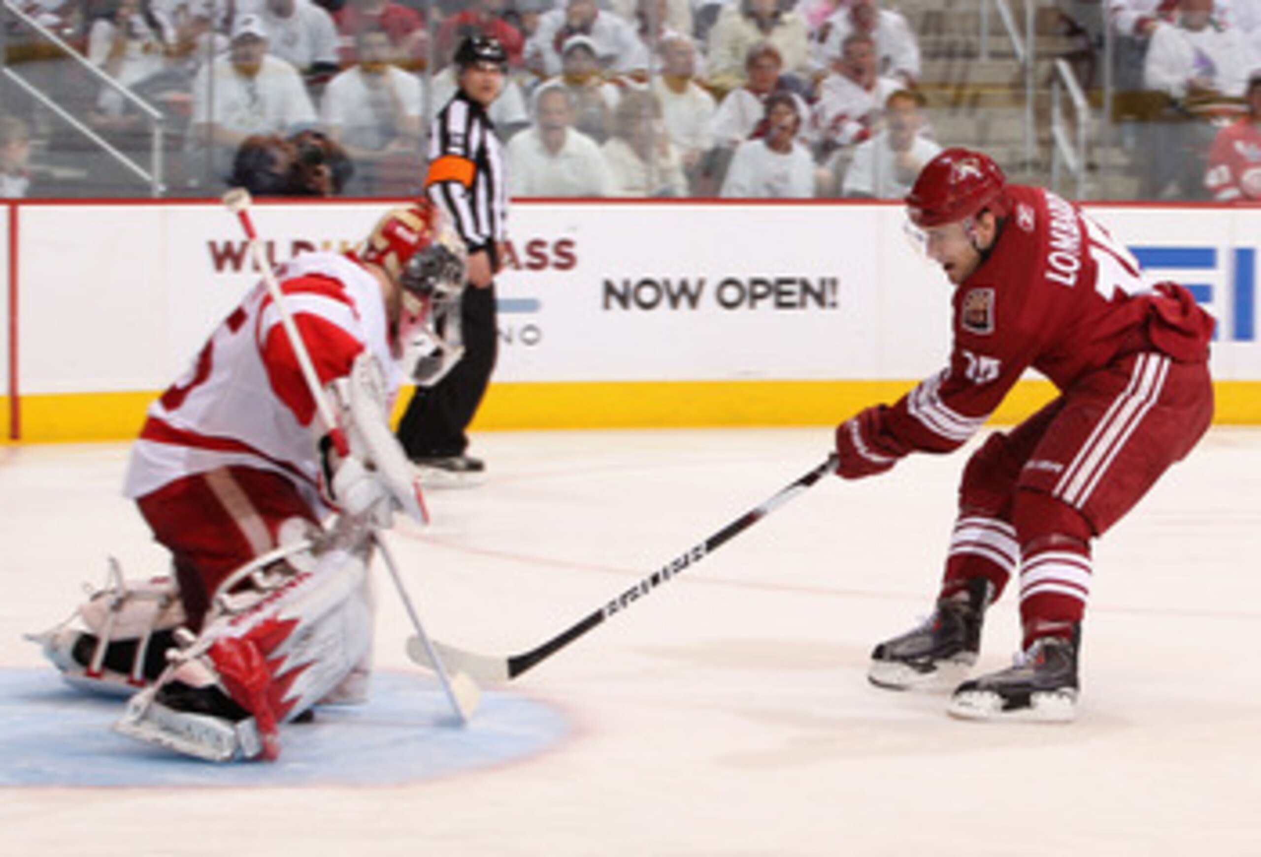 GLENDALE, AZ - APRIL 16:  Matthew Lombardi #15 of the Phoenix Coyotes scores a second period goal through the legs of goaltender Jimmy Howard #35 of the Detroit Red Wings in Game Two of the Western Conference Quarterfinals during the 2010 NHL Stanley Cup
