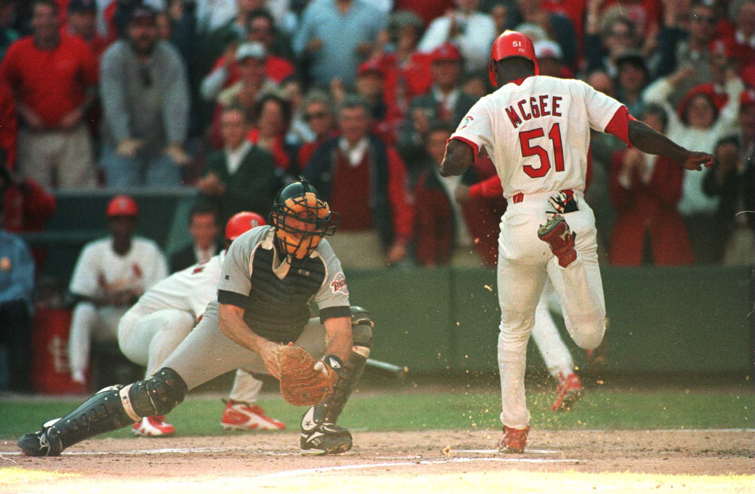 3 Oct 1996: Runner Willie McGee of the St. Louis Cardinals scores past catcher John Flaherty of the San Diego Padres in game 2 of the National League Divisional Playoffs at Busch Stadium in St Louis, Missouri.
