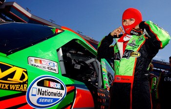 BRISTOL, TN - MARCH 19:  Danica Patrick, driver of the #7 GoDaddy.com Chevrolet, stands next to her car on the grid prior to the start of the NASCAR Nationwide Series Scotts EZ Seed 300 at Bristol Motor Speedway on March 19, 2011 in Bristol, Tennessee.  (