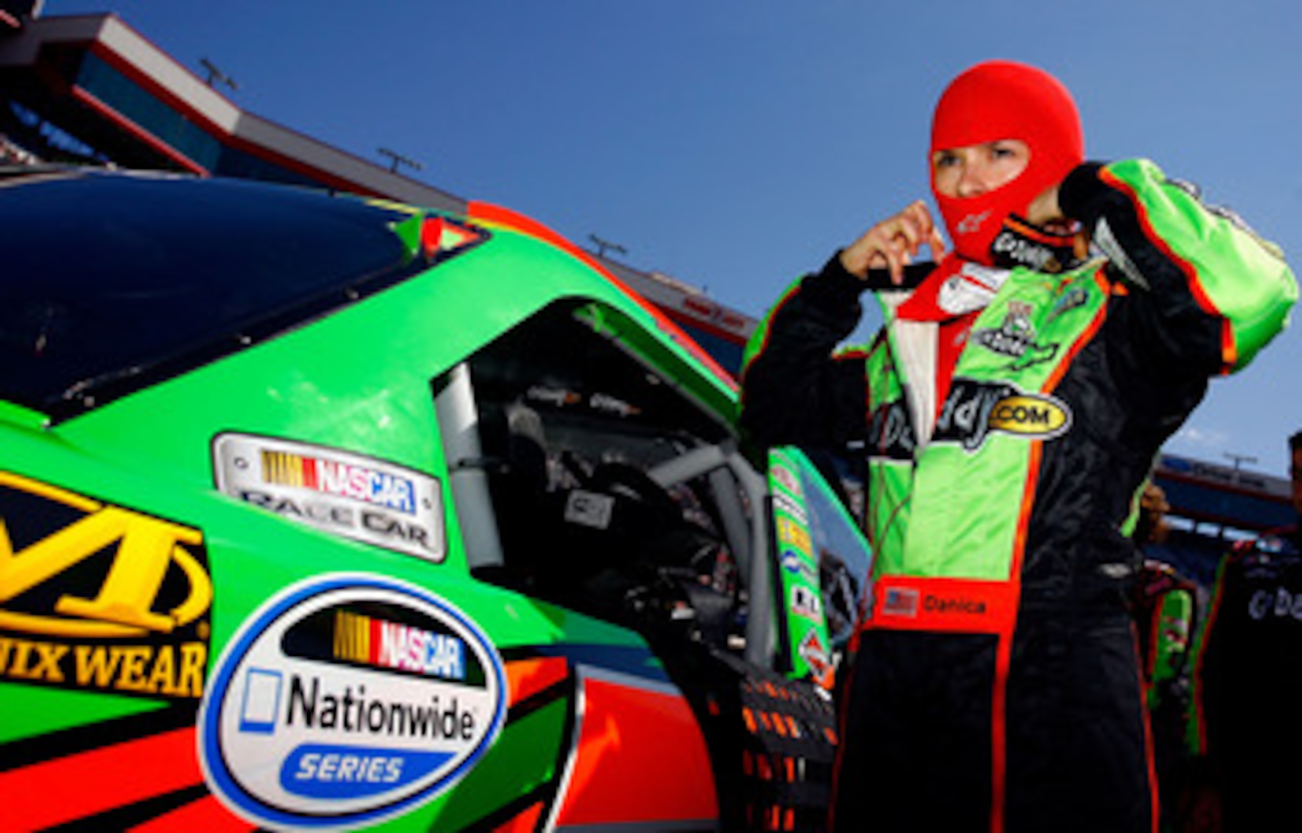 BRISTOL, TN - MARCH 19:  Danica Patrick, driver of the #7 GoDaddy.com Chevrolet, stands next to her car on the grid prior to the start of the NASCAR Nationwide Series Scotts EZ Seed 300 at Bristol Motor Speedway on March 19, 2011 in Bristol, Tennessee.  (