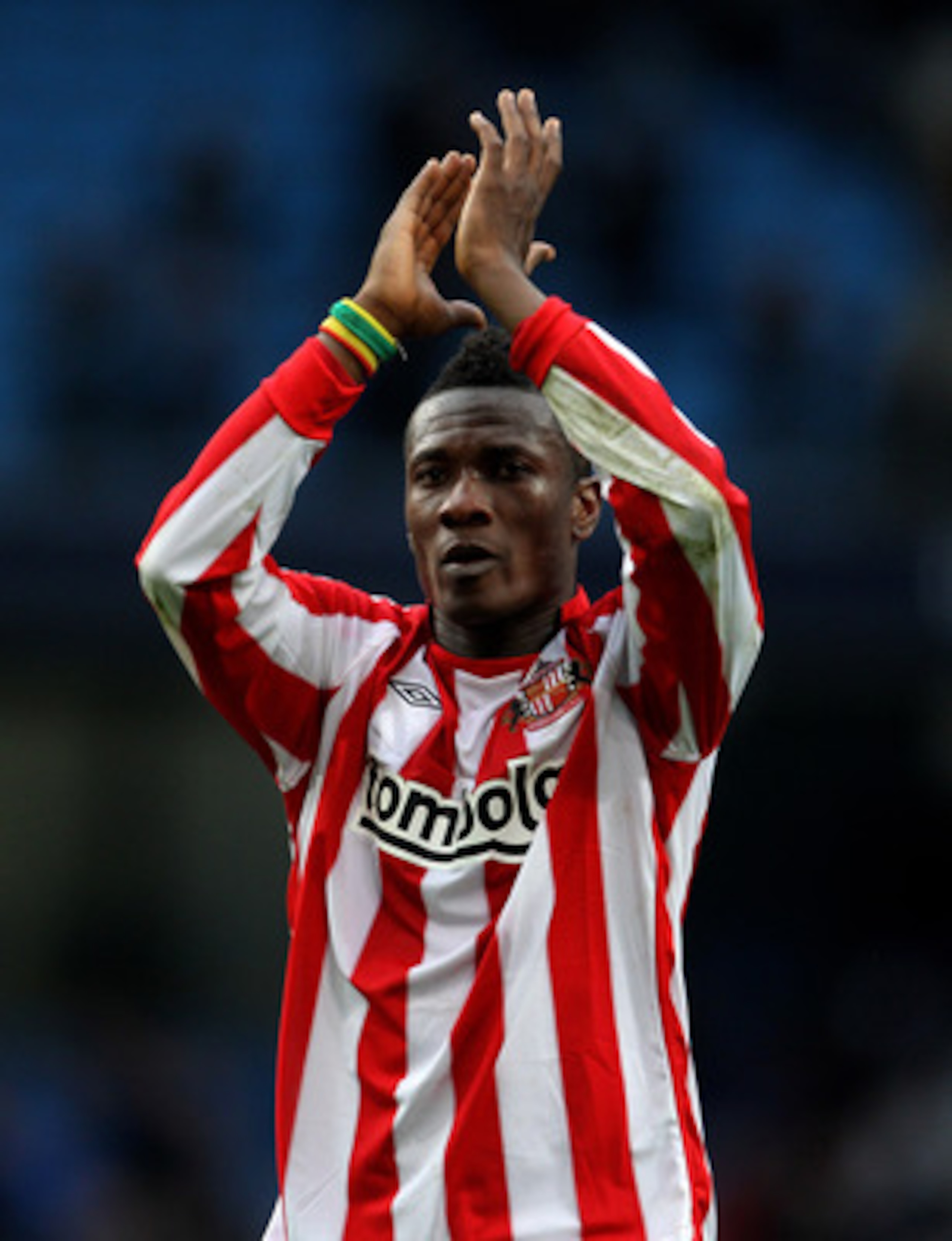 MANCHESTER, ENGLAND - APRIL 03:  Asamoah Gyan of Sunderland applauds the fans at the end of the Barclays Premier League match between Manchester City and Sunderland at the City of Manchester Stadium on April 3, 2011 in Manchester, England.  (Photo by Alex