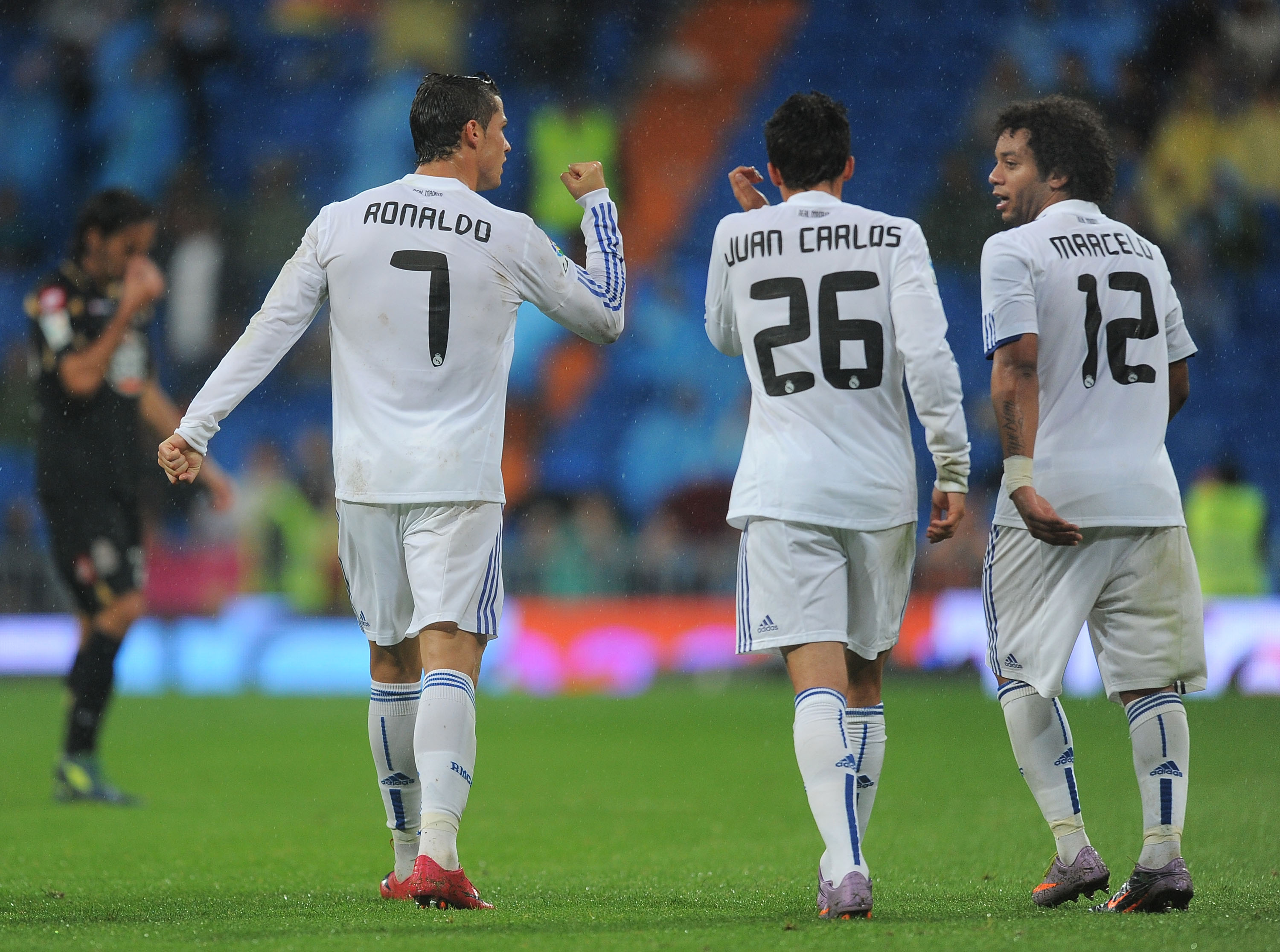 MADRID, SPAIN - OCTOBER 03:  Cristiano Ronaldo of Real Madrid celebrates with Juan Carlos and Marcelo  after scoring Real's sixth goal during the La Liga match against Deportivo La Coruna  at Estadio Santiago Bernabeu on October 3, 2010 in Madrid, Spain.