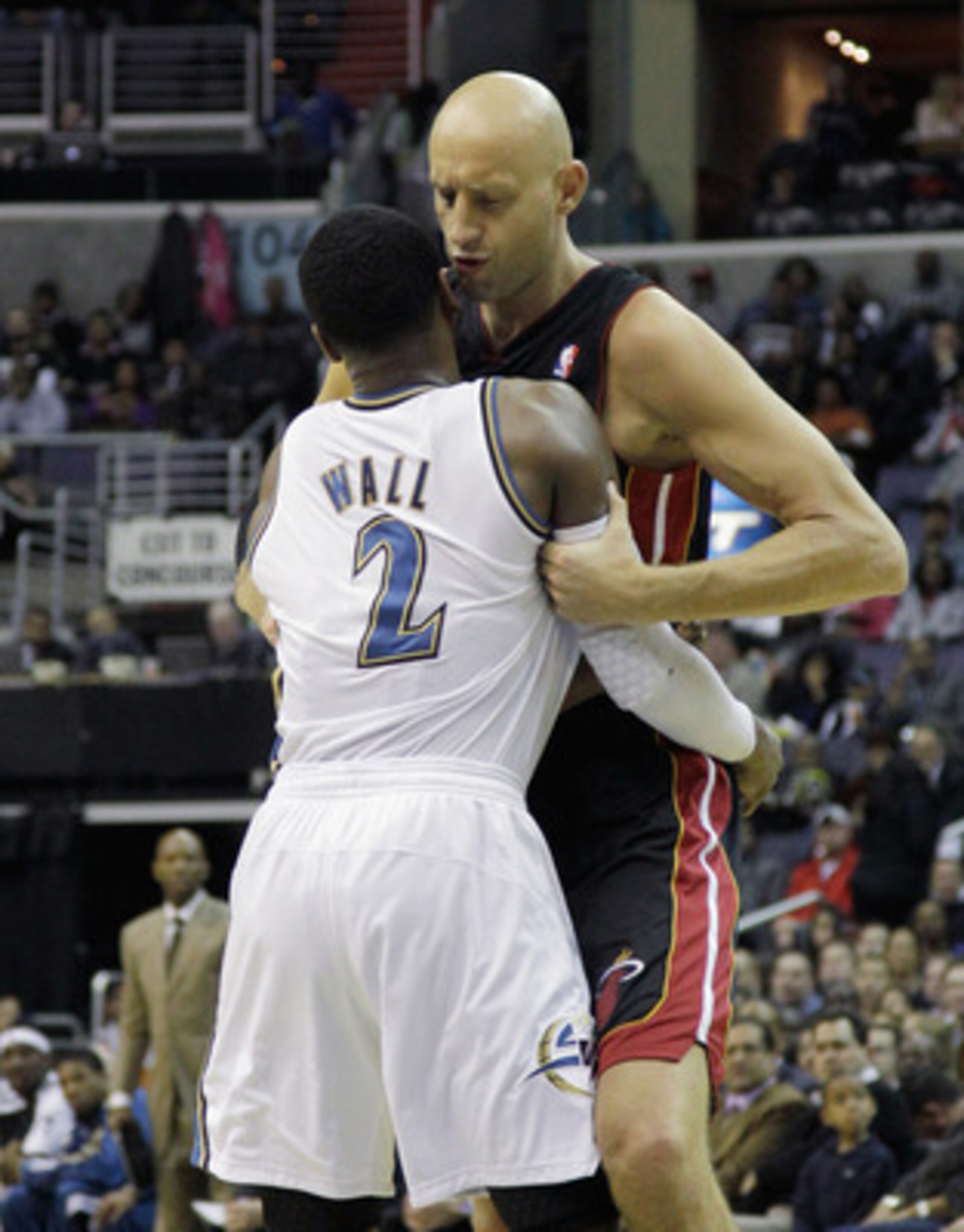 WASHINGTON, DC - MARCH 30: John Wall #2 of the Washington Wizards and Zydrunas Ilgauskas #11 of the Miami Heat exchange words at the Verizon Center on March 30, 2011 in Washington, DC. NOTE TO USER: User expressly acknowledges and agrees that, by downloa WASHINGTON, DC - MARCH 30: John Wall #2 of the Washington Wizards and Zydrunas Ilgauskas #11 of the Miami Heat exchange words at the Verizon Center on March 30, 2011 in Washington, DC. NOTE TO USER: User expressly acknowledges and agrees that, by downloa